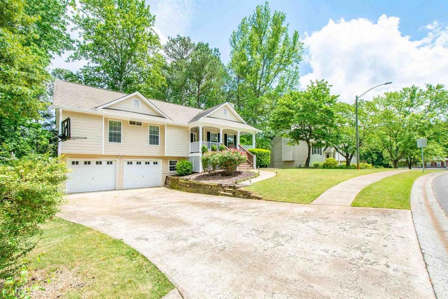 Hard to find raised ranch with all neutral interior. Covered front porch, custom ship lap in living room and entry*vaulted ceiling*DR w/hardwoods*Kitchen with granite counter tops and white cabinetry & white tile back splash* Master is bright & open*updated bath with double vanity, tile surround garden tub, tiled shower has seat & seamless glass enclosure*new lights and faucets etc. nice sized 2ndary bdrms*updated 2nd bath w/newer vanity, updated tile and tiled tub/shower. Lower level is finished w/den, 4th bedroom with custom bookcases, spacious closet* craft room/playroom and newer bath with huge tiled shower*seamless glass enclosure, raised toilet, new vanity & granite and storage closets. Awesome deep 2-car garage that is approx 30 ft deep. Great backyard too! Seller took under the deck that is perfect for watching the games (wired for TV) and grilling too! Fire pit & exterior lighting. Sought-after school district, 5 min. to Lake Allatoona and less to shopping! Rose Creek offers swimming pool amenities and a playground too. Pride in ownership and move-in ready!!! Architectural shingle roof