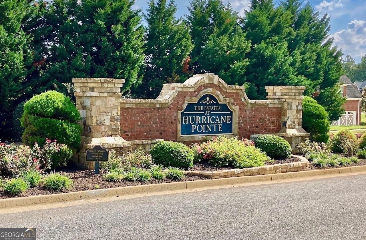 Great opportunity to Build your Dream Home in the Amazing Estates at Hurricane Pointe on Lot 96. Discover the epitome of luxury living in this exquisite land lot nestled within this prestigious neighborhood. Boasting panoramic views, this parcel of paradise offers a canvas for your dream residence. Envision a lifestyle of opulence surrounded by lush landscapes and the tranquility that comes with residing in this exclusive enclave. Don't miss the opportunity to build your legacy on this remarkable piece of land. Homes in the Neighborhood are selling between the $600's - 700's! What more can you ask for:One of the Best Communities, Best schools in the area,Over an acre land lot of privacy. Easy drive to Atlanta airport, Carrollton, Newnan, or Campcreek. Agents /Buyers do your due diligence regarding the HOA. When the Seller purchased the Land, the HOA was not mandatory. Check with the HOA to confirm if all new builds in the community will automatically be a part of the HOA. Seller does not have any information on the HOA. The buyer or builder must complete their own due diligence with the HOA and all building codes and requirements.