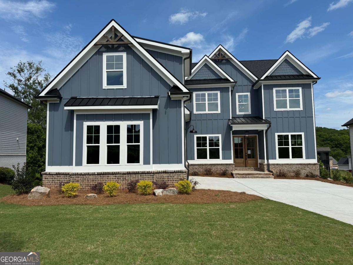 NEW CONSTRUCTION / CHELSEA FLOORPLAN built by Bright View Homes - Stunning 5-Bedroom / 4-Bathroom home with Courtyard entry 2-Car Garage with LARGE additional space for Golf Cart or Storage - Unfinished Basement. BLINDS INCLUDED. Modern living with its open concept design, perfect for gathering and entertaining. Elevated home design with sleek finishes. Upgraded Trim Package includes cedar boxed beams Ceilings in the Great Room & the Formal Dining Room, Shiplap Accent Walls and Cove Crown molding & baseboards. Interior Brick fireplace Floor to Ceiling. "Game Day" covered SCREENED IN back Porch with connection for TV. Great Room Opens to the Breakfast & Kitchen. Gourmet Kitchen offers beautiful Quartz Countertops, luxury Shaker Style Cabinets with soft close, Farm Style Apron Front Kitchen Sink, decorative Cabinet Style Vent Hood over 5-Burner Gas Cook Top and Stainless Steel Appliances. Huge Walk-in Pantry. Mudroom off the Kitchen. Bedroom & Full Bathroom on the Main. Upstairs you'll find a large Media Room, the Primary Suite, Laundry, 3 Secondary Bedrooms and 3 full Bathrooms. Primary Suite features a spa-like ensuite bathroom with a Free-Standing Tub & Enlarged Approx. 8FT Shower with Dual Shower Heads, Tiled Bench & Niche. HIGHLY SOUGHT AFTER TRADITIONS OF BRASELTON COMMUNITY AND JACKSON COUNTY SCHOOL SYSTEM! This wonderful community offers Swim, Tennis, Pickle Ball, gym, Golf, a private Restaurant for members, a playground and so much more! CLOSE IN 30 DAYS OR LESS!
