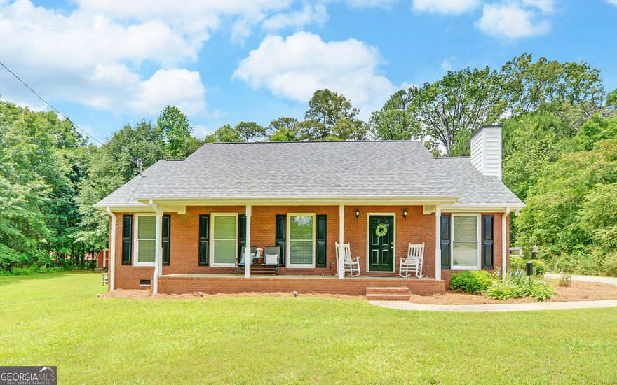Nestled in the tranquil cul-de-sac of a quiet neighborhood in Toccoa, this well-maintained, newer 4-side brick ranch offers a serene and private living experience on a spacious 1.3-acre lot. The home features 3 bedrooms and 2 full baths, with the master suite conveniently located on the main floor. The master bath offers a new walk-in shower. Throughout the home, you'll find beautiful LVP flooring, complementing the modern and comfortable aesthetic.    The kitchen is equipped with high-end stainless steel appliances, only 2 years old, with small closet pantry and bar-top breakfast area, making it a delight for any home chef. The living room is open concept  to the dining room and kitchen, with vaulted ceilings and a gas fireplace. A new water heater ensures peace of mind and efficiency. This home is ideal for those seeking a perfect starter home or looking to downsize in retirement, offering virtually step-less living for ease and accessibility. All furniture in the home remains unless Buyer requests removal.     Outdoor amenities include a charming covered front porch, a large deck perfect for entertaining or relaxing, and a covered carport directly off the kitchen for convenience. Additionally, there is a small storage shed on the property, providing extra space for your storage needs. This lovely ranch home promises a blend of comfort, style, and tranquility in a picturesque setting.