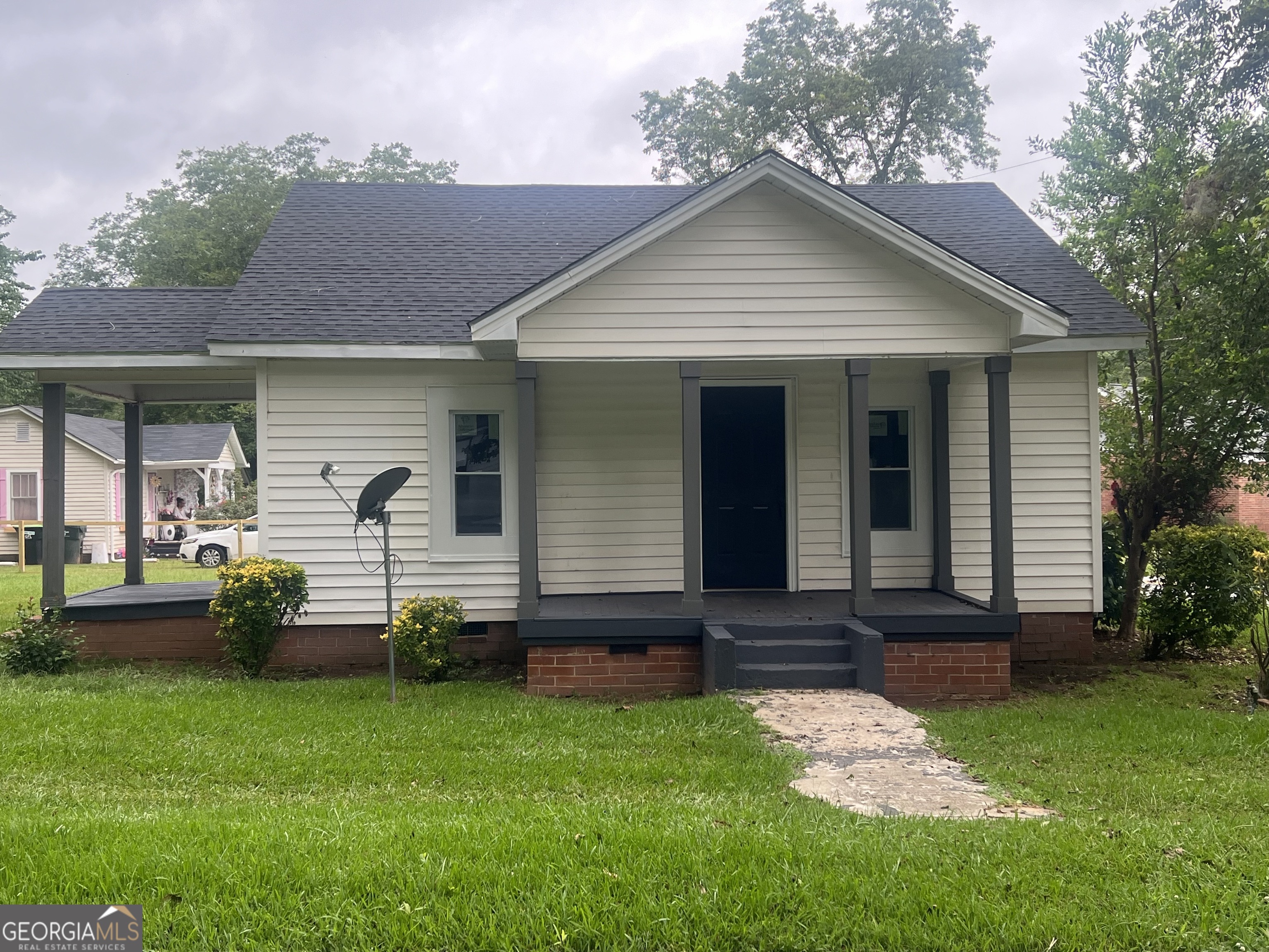Cute! Cute! Cute! This remodeled 2 bedroom, 1 1/2 bath home located in the city on corner lot! Perfect for starting out or slowing down! Remodeled kitchen with new range, microwave and new dishwasher, living room, central heat and air. Property has separate laundry room and beautiful hardwood floors. Choose your porch for those warm summer days. Front porch, side porch and deck on rear. This is just a little dollhouse ready for you to move into. Forget about renting and own your own home for basically the same price.