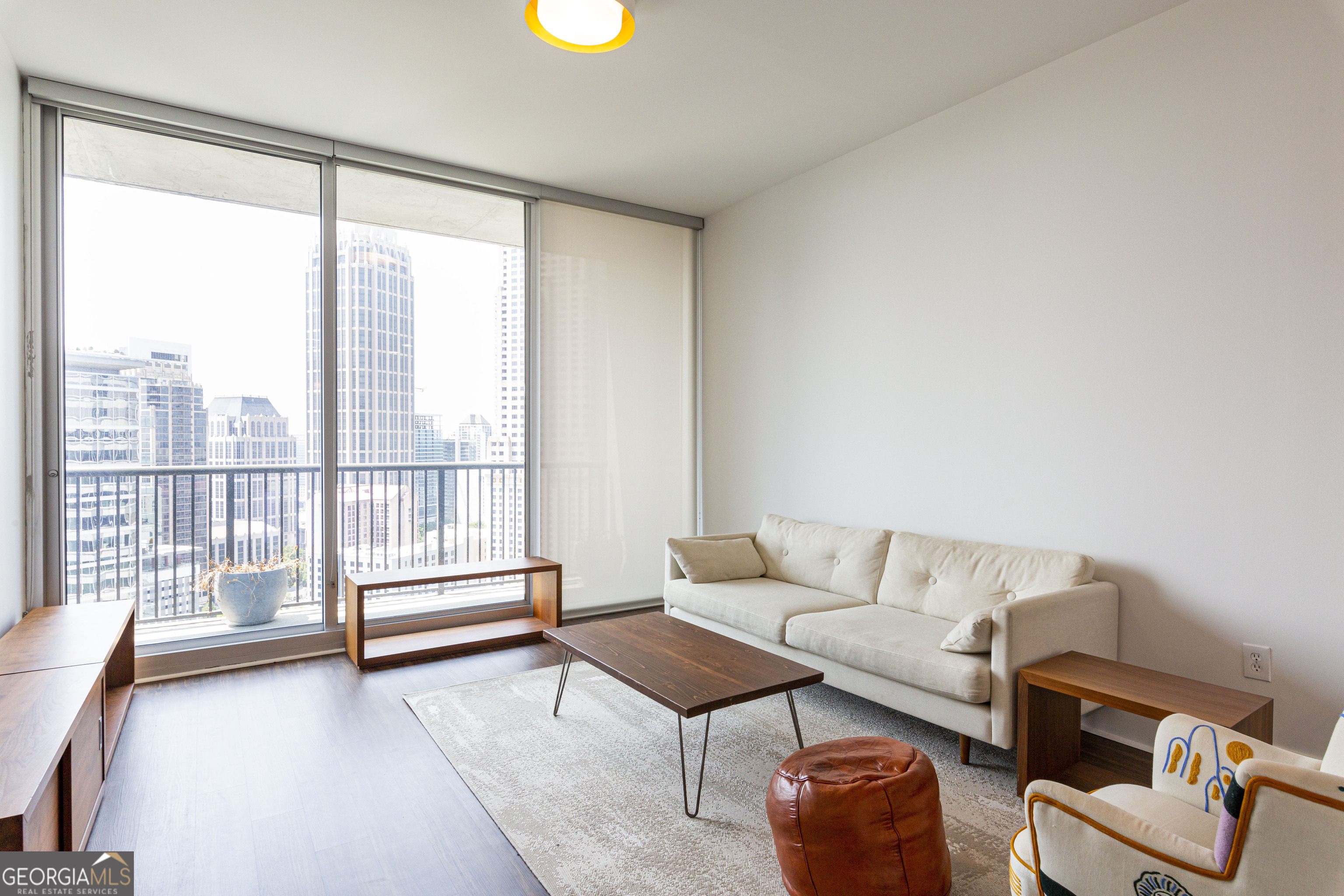 Breathtaking views from this luxury 21st-floor unit at 1010 Midtown, one of Midtown's most coveted buildings! Walk into the home through the gallery foyer and be greeted with floor-to-ceiling windows sharing an abundance of natural light throughout. The kitchen boasts luxurious granite countertops, stainless steel appliances and breakfast bar. Relax and unwind in the living room or on the oversized balcony while enjoying the picturesque Midtown Atlanta views. Wake up to the same lively views from the bedroom. The unit has been updated in last two years with white paint, smart-thermostat and a new water heater. 1010 Midtown offers amazing amenities, including a 24-hour concierge, gated parking garage, clubroom, rooftop pool, fitness center. Walk to the very best of Midtown Atlanta's restaurants, Piedmont Park, offices and shopping. This unit comes with one deeded parking spot. Schedule a showing today and see why 1010 Midtown provides one of the best locations for in-town living!