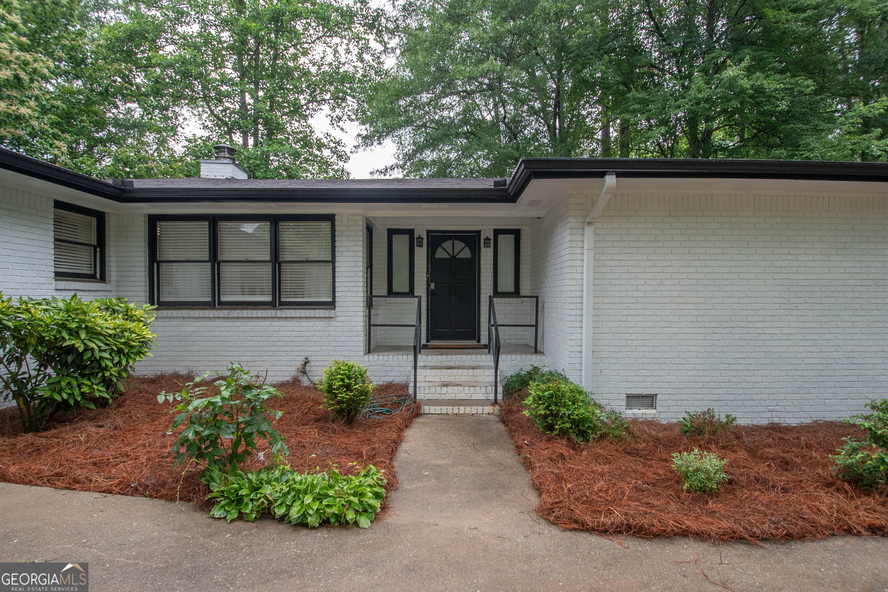 PREFERRED LENDER IS OFFERING AN ADDITIONAL $2000 AT CLOSING*** Call to find out more details about this amazing offer! Charming Updated Farmhouse on 5+ Acres - Mini Farm Near Serenbe & Cochran Mill Park! Welcome to your dream country retreat! Nestled on over 5 picturesque acres, this beautifully updated 3-bedroom, 2-bath all-brick farmhouse offers the perfect blend of rural charm and modern comfort. Located just minutes from the sought-after Serenbe community and Cochran Mill Park, and with convenient access to South Fulton Parkway, this property provides the ideal balance of seclusion and accessibility. Step inside to discover a light-filled, open concept living area featuring sleek stainless steel appliances, a cozy wood-burning stove, and elegant updates throughout. The home offers low-maintenance living in a classic farmhouse setting. Outside, you'll find everything you need for a mini farm lifestyle - a fenced backyard, outdoor shed, and plenty of space for farm animals or a master garden. With road frontage on two sides, this property offers flexibility and convenience for access or potential expansion and potential use as an Air bnb! Whether you're looking for a private homestead, a small-scale farm, or a peaceful escape close to nature and community, this one-of-a-kind property has it all. Call today for an appointment to view! Preferred lender Frank Bennett with Element Home Loans is offering a $2000 lender credit at closing to approved buyers!