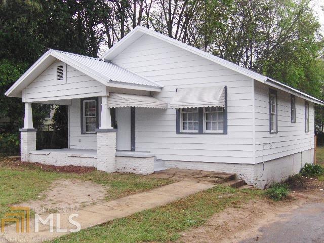 This 2BR/1 bath vinyl sided home has been freshly painted inside & out with a new metal roof. Covered front porch, partially fenced back yard. Move in ready - just need to add kitchen appliances. New heat/air system will be installed with full price offer!