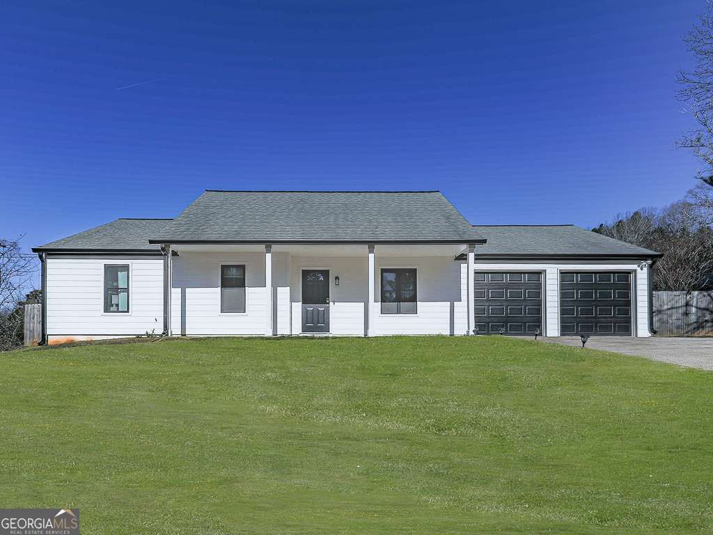 Photo of 606 Bluff Drive, Woodstock, GA 30188 (MLS # 10657951)