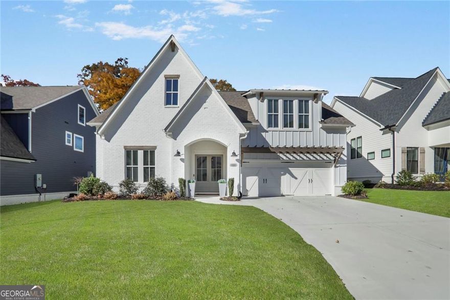 You will be enchanted by this EAST-FACING "NEARLY NEW" Home with Owners' Suite on the Main Level. Nestled in Kelly Mill Reserve, and reporting into well-rated West Forsyth High School, this property boasts an open floor plan and up-to-trend finishes. The stately double wood doors at the entry set a tone of elegance. Glistening hardwoods "greet you" as you traverse through the light-filled foyer and into the great room. The kitchen sparkles with its white shaker cabinets, quartz counters, sparkling light fixtures, and stainless appliances. And with the large breakfast counter, the dining area, and the walk-in pantry - you have everything you need for entertaining. The great room is adorned with high beamed ceilings. Built-in shelving flanks a wood-beamed mantle at the fireplace. Light a fire on these upcoming colder days. Convenience is your "mantra" with this owners' suite AND office on the main level. Retire to a spacious bedroom with sitting area, a bath with double quartz vanities and free-standing soaking tub, and a generously sized walk-in closet. Upstairs are three more large-sized bedrooms with an unexpected "loft-style" common area, great for a study or even an exercise space. There are also two baths upstairs; all with white cabinetry and stone counters. If storage is a concern, the walk-in attic will be a welcomed feature on this property. And if the outdoors is your passion, the patio and the flat, fenced, grassy backyard are a "must-see"; private with no homes behind you. Kelly Mill Reserve is a 23-home community; charming with one street in and one street out; close to the Cumming City Center for concerts, enjoying a bite to eat, or doing some shopping. And if a walk, a run, or a bike ride suits you, the Big Creek Greenway is also close by. All these things and more make 5040 Reserve Drive a fantastic place to call "home".