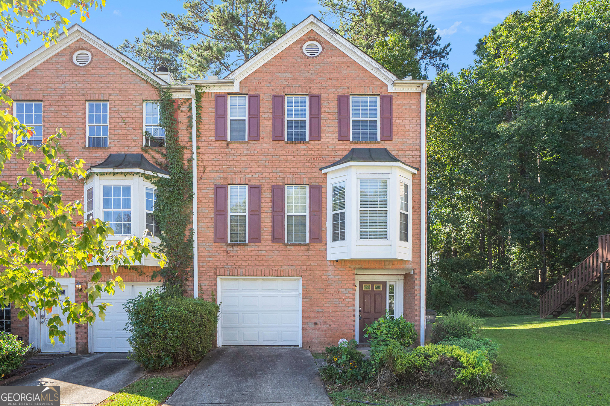 Move-in Ready 3-Story Townhome in Lawrenceville! Step inside this nicely maintained home featuring 9 ft. ceilings, gleaming hardwood floors, and an abundance of natural light throughout. Offering 3 spacious bedrooms and 3.5 bathrooms-including a full basement-this home provides plenty of space and flexibility. The kitchen boasts ample pantry storage, while the inviting living area is centered around a cozy fireplace. Enjoy outdoor living with a private backyard, perfect for relaxing or entertaining. Added bonuses: NO HOA and NO rental restrictions!