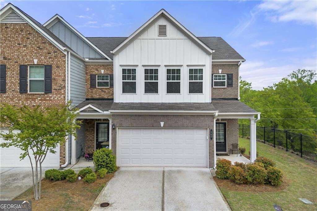 Discover the perfect blend of style and convenience at this beautifully appointed townhome just minutes from the heart of Downtown Woodstock. Nestled in a vibrant community where you have easy access to your favorite Publix grocery store, top-rated schools, and over 30 local shops and dining destinations, this light-filled end unit offers the ideal lifestyle for today's modern homeowner. Built in 2021, this townhome boasts an open-concept floor plan with an inviting kitchen featuring modern cabinetry and plenty of space to entertain or simply unwind in comfort. Natural light pours through every room, accentuating the thoughtful design and airy ambiance throughout. Upstairs, you'll find three generously sized bedrooms, including an expansive owner's suite with a spa-like bath and oversized walk-in closets in every room ideal for those who appreciate both luxury and functionality. Whether you're enjoying a peaceful evening at home or venturing out to the nearby Outlet Shoppes at Atlanta for designer finds, this location puts you in the center of it all charming, connected, and incredibly convenient. Welcome to your next chapter in Woodstock's most sought-after address.
