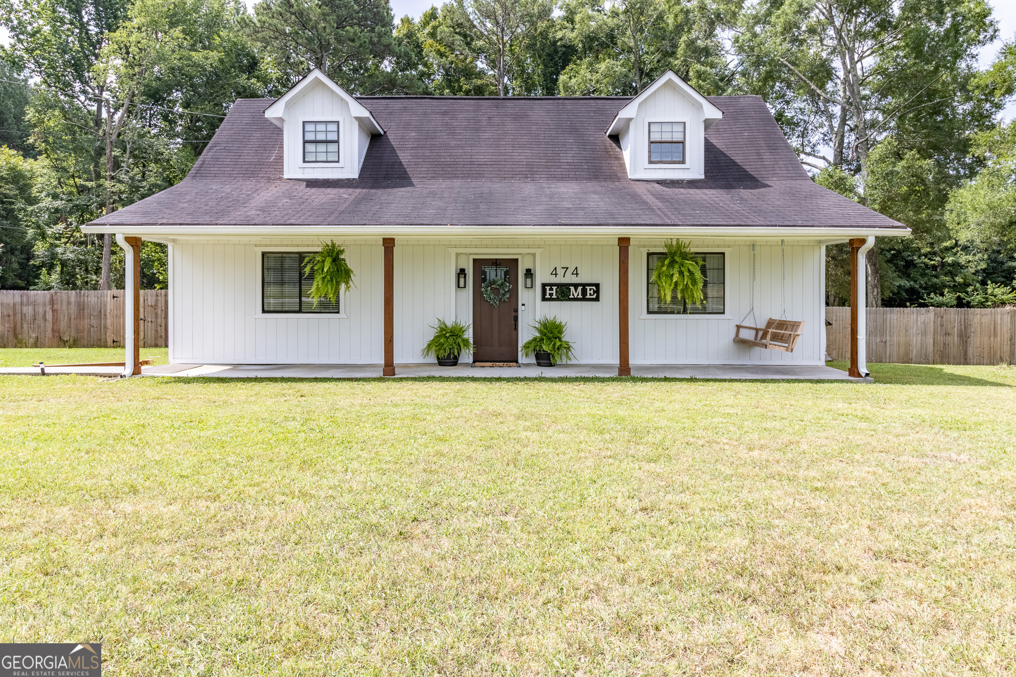 Modern farmhouse charm just minutes from Queen City Lake, hiking & biking trails, and downtown LaFayette - all within a 35-minute drive to Chattanooga! This beautifully updated 3BR/1.5BA home features a spacious main-level primary bedroom, two cozy upstairs bedrooms with dormer nooks, and a bonus office space at the top of the stairs - great for remote work or study. The kitchen has been upgraded with quartz countertops, soft-close cabinets, open shelving, and stainless appliances. The open living area includes custom built-ins and updated lighting, while the full-length front porch with wood posts and a classic porch swing adds the perfect touch of southern charm. Out back, enjoy the screened-in porch and large, fenced yard - ideal for kids, pets, or entertaining. A stylish, move-in ready home in a peaceful setting with easy access to outdoor recreation and city convenience! Schedule your showing today!