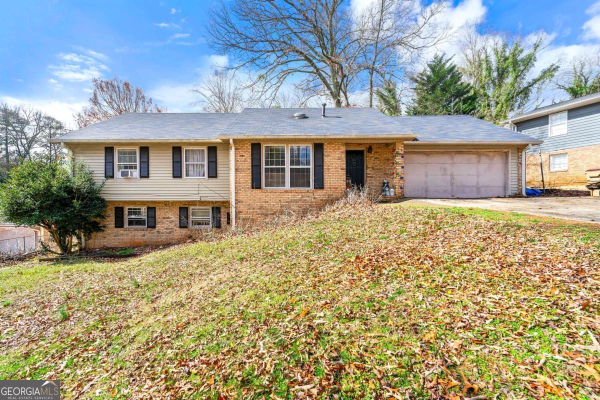 Spacious 5-Bedroom Brick Home in Marietta Co Prime Location & Endless Potential! Nestled at the end of a quiet cul-de-sac, this charming 4-sided brick home offers 5 bedrooms and 4 bathrooms, with plenty of room to customize and make it your own. The kitchen features a large island with a breakfast bar and dining areaCoperfect for gathering. The main level boasts three bedrooms and two baths, including a primary suite. Upstairs, you'll find one bedroom and one bath, plus flexible space for two additional bedrooms, a playroom, or an office. The finished daylight basement adds even more versatility with options for a bedroom, or office. This home is ready for your personal touch. Conveniently located minutes from I-75, I-575, Town Center, KSU, and Kennesaw Mountain.