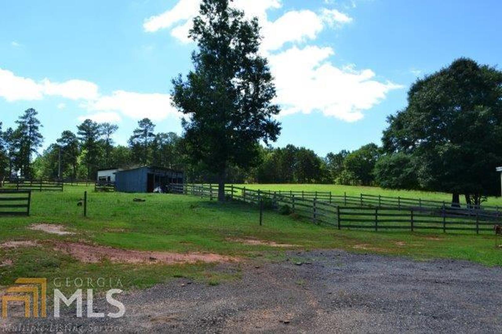 26.14 former horse farm in Meriwether County with 2 horse barns (48x48 and 37x72) that includes multiple stalls. This property was previously used as a breeding operation according to the current owner. Additionally, there is a 4 bay shop with office that is heated and cooled. A vehicle lift is negotiable. Several fenced pastures and a pond on the property for the fisherman in the family. **Conventional financing only, please. House, because of 26 acres, metal building and 2 horse barns will not go VA or FHA. AgSouth can finance with 15% down for 15 years or 20% down via conventional financing for 30 years.** *DO NOT USE THE "SHOWING TIME" OPTION IN GAMLS TO MAKE AN APPOINTMENT.*