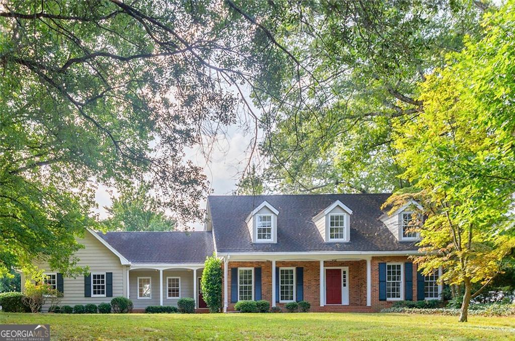 BEST VALUE & OPPORTUNITY IN VANDERLYN! Charming Brick Cape Cod located on a quiet cul-de-sac in walking distance to Vanderlyn ES and Dunwoody High, this classic home sits on a large private lot with a walk-out, level backyard-perfect for play, pets, or entertaining. Enjoy a huge screened porch with brick flooring + beautiful hardwood floors on both levels. The main floor offers a bedroom and full bath, with the option to create a sizable primary suite on main. Updated bathrooms and spacious bedrooms throughout make it easy to move right in, while plenty of upside remains to make it your own. Unfinished daylight basement with additional room with access to the backyard. This home is an unbeatable value in a premier location!