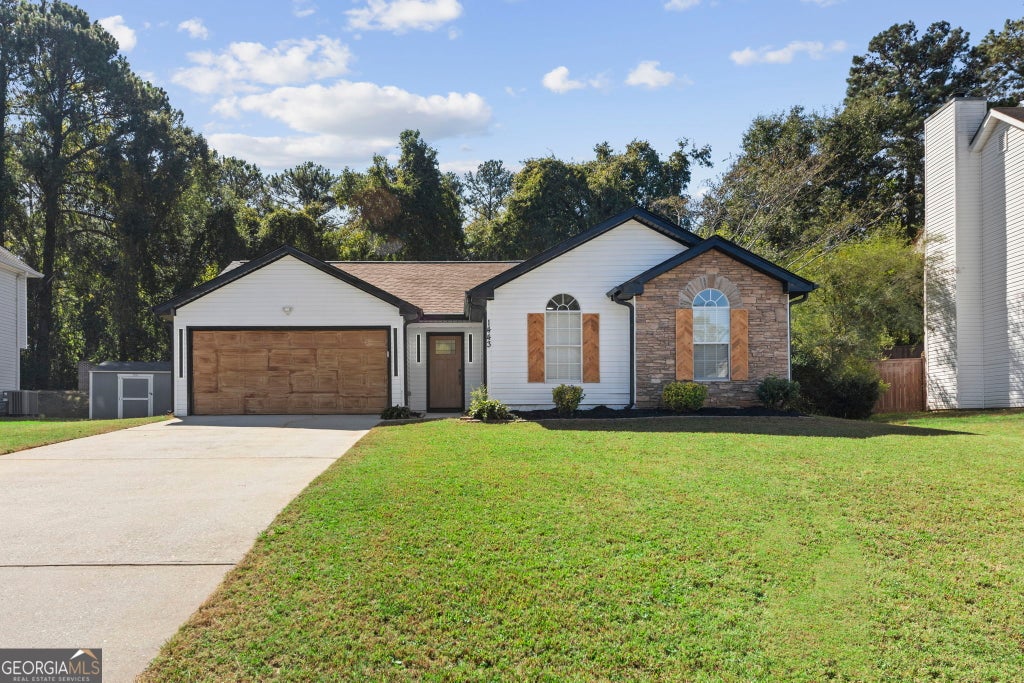 Photo of 1443 Pebble Ridge Lane, Hampton, GA 30228 (MLS # 10880362)