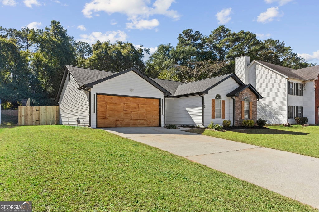 Photo of 1443 Pebble Ridge Lane, Hampton, GA 30228 (MLS # 10880362)