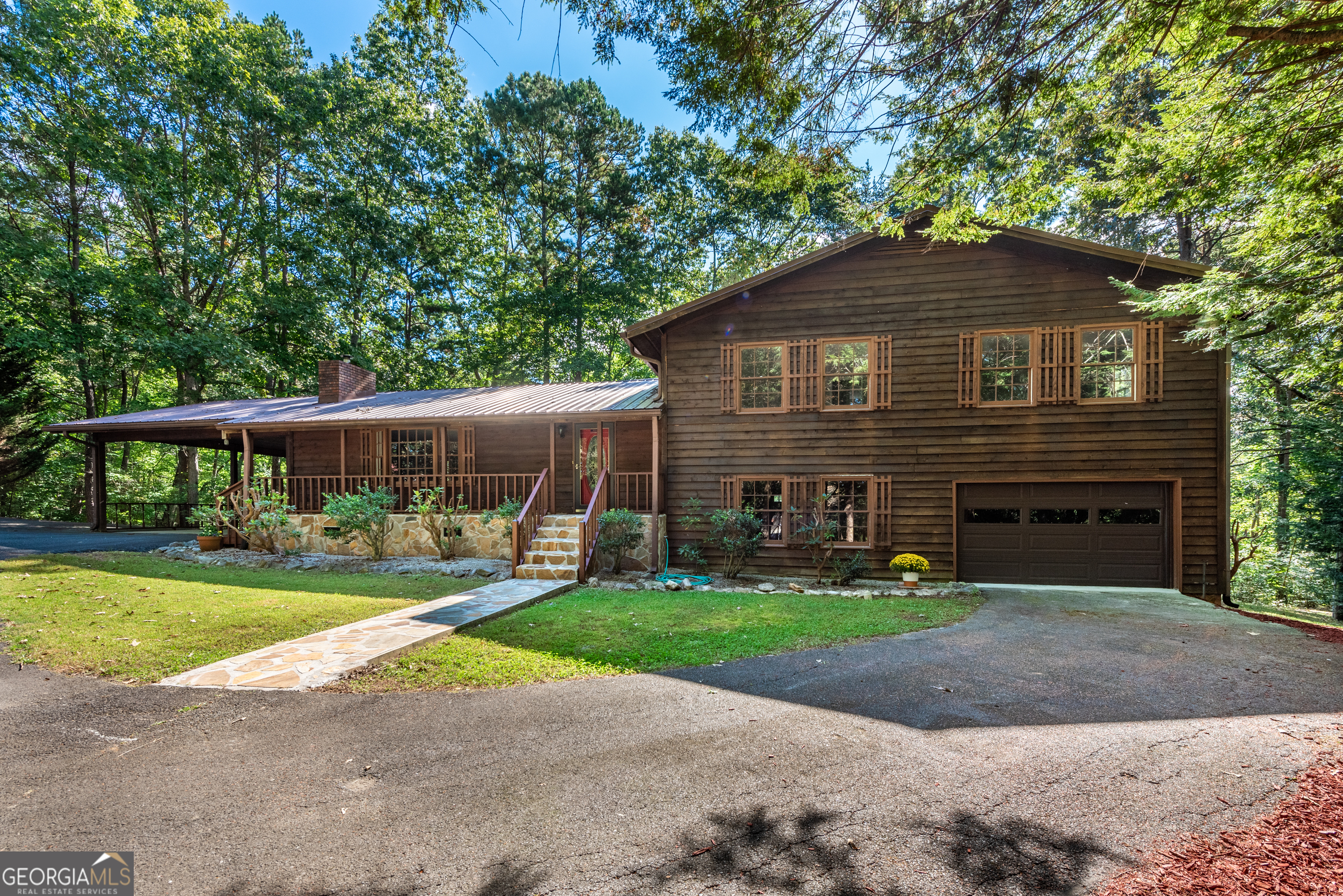 Take a second look at this Gem! It's Move in Ready and available for a quick closing. This home has been improved and is better than ever!. Tucked into an attractive neighborhood in the heart of Ellijay, this updated 4-bedroom, 2.5-bath home offers the perfect blend of space, privacy, and renovations. Situated on a generous 1.5-acre lot with no HOA, the property provides endless possibilities-there's ample room to add a backyard pool, park an RV and boat, and still enjoy plenty of open space. Though privately set, the home is conveniently located just minutes from downtown Ellijay, offering easy access to shopping, restaurants, events, and more. The home's exterior showcases a metal roof, complemented by plenty of parking options including a large carport on the kitchen level, a lower-level garage with an automatic door, and a spacious circular driveway. Inside, you'll find fresh paint, new carpet and LVP flooring and new fixtures along with bathrooms featuring granite countertops. A cozy wood-burning stove adds warmth and charm to the main living area, while two wall-mounted gas heaters-one of which is brand new-provide reliable backup heat IN ADDITION TO the BRAND NEW central heating and cooling system. Utilities include city sewer, public water, and availability of natural gas and high-speed internet. Recent improvements to the crawl space include new insulation, a vapor barrier, and newly installed power vents for proper ventilation. Additionally, termite bond and system has been installed and comes with a transferable bond. SELLERS ARE LOOKING FOR AN AS IS SALE.