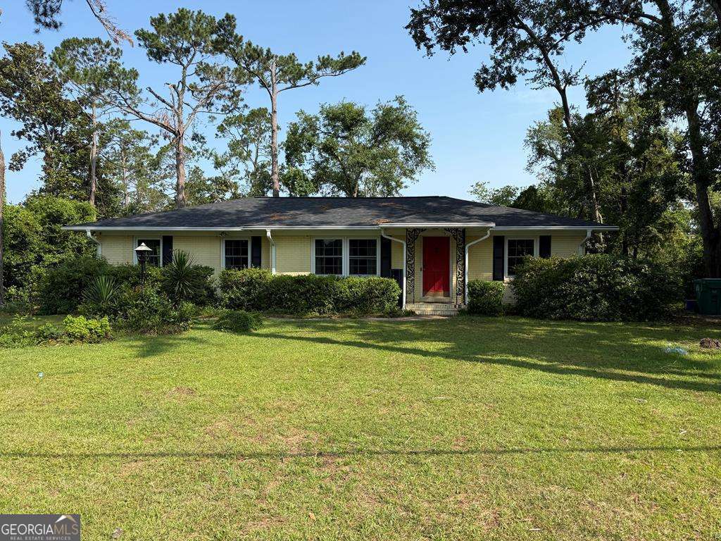 Charming Yellow Brick Bungalow Near VSU! Welcome to 604 Azalea Circle - a darling updated bungalow located just minutes from Valdosta State University. This beautifully maintained home features freshly installed hardwood floors throughout, bringing warmth and character to every room. New energy-efficient windows brighten the home with natural light. Step out back to enjoy a large deck that overlooks a spacious backyard - perfect for entertaining or quiet evenings outdoors. This home offers timeless charm with thoughtful improvements made throughout the current owner's time here. Whether you're a first-time buyer, downsizing, or looking for an investment close to campus, this one is worth a visit!