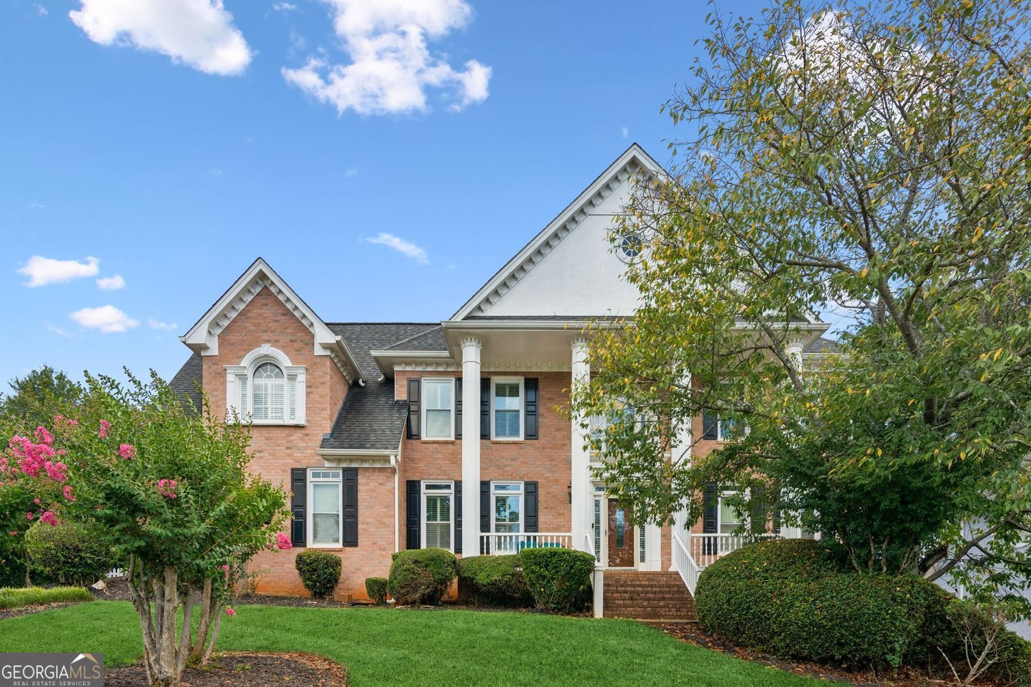 This spacious 5-bedroom, 3 full and 2 half-bath home is located in the desirable Trotters Ridge subdivision in Snellville. Set on a well-landscaped lot with an expansive, level backyard, it's perfect for outdoor activities and entertaining. Upon entry, a dramatic two-story foyer welcomes you, with a private office featuring French doors to the right and a formal dining room to the left. Rich hardwood floors flow throughout the main level, which includes a family room with coffered ceilings and a marble fireplace that opens to a screened-in patio with ceiling fans, bead board ceiling, and porcelain exterior flooring. The chef's kitchen boasts a large center island, butler's pantry, gas cooktop, double ovens, breakfast bar, and recessed lighting. Off the kitchen, a vaulted sunroom with built-in bench seating offers a bright, inviting space. Outdoor living spaces include a deck and a covered patio with an outdoor fireplace, ideal for year-round entertaining. Upstairs, the primary suite features a vaulted ceiling, double vanities, a jacuzzi tub, a large walk-in closet, and a custom tiled shower with dual shower heads, bench seating, and a built-in niche. Three additional bedrooms offer walk-in closets and share two Jack-and-Jill bathrooms. A fifth upper-level room, currently used as a custom walk-in closet, can easily be converted back into a bedroom. The basement offers excellent potential for customization and is priced to reflect necessary updates. This property presents a wonderful opportunity to personalize your dream home in a sought-after community. Book your showing today!