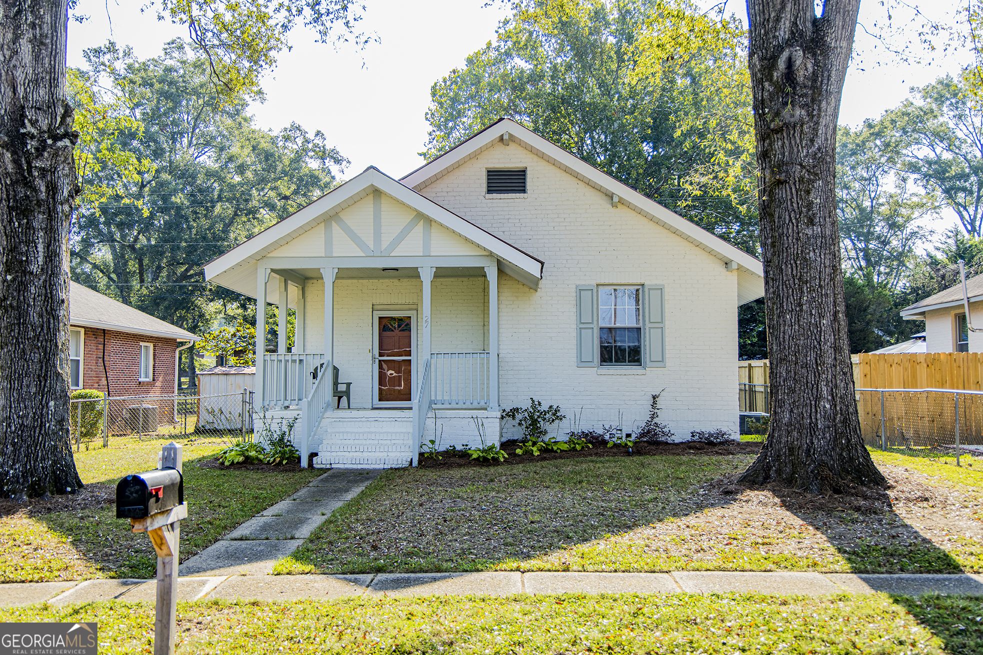 Charming 2-bedroom, 1-bath brick cottage in the Model School District. This home offers a spacious living area with a fireplace, an updated tiled bathroom with a new vanity, and new flooring throughout. Electrical and plumbing have been updated, and the home features a durable metal roof. Enjoy the fenced backyard with patio space, plus off-street parking via alley access to a 1-car carport. A great mix of updates, charm, and convenience!