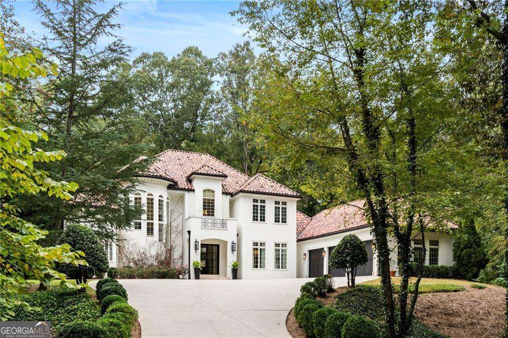 Introducing an Exquisite Oasis in the Heart Vinings Georgia. Close to Westminster, Lovett, Holy Innocents!! Welcome to 3401 Stillhouse Road, the epitome of luxury living nestled on a secluded street less than a mile from the vibrant Jubilee. This exceptional residence offers unparalleled charm and character in every corner, creating an inviting and serene retreat for the discerning buyer. Step inside and be captivated by the chef's dream gourmet kitchen, a culinary haven boasting top-of-the-line stainless appliances, including a 6-burner gas range, paneled refrigerator, and an expansive custom island of unique rugged quartz. Whether you're a seasoned chef or simply enjoy preparing meals, this kitchen will inspire your culinary creativity. Indulge in resort-style living in your own backyard paradise. The expansive patio, partially covered for year-round enjoyment, beckons you to relax and entertain in style. Take a dip in the oversized saltwater pool and spa, or gather around the fireside outdoor living space, creating memories that will last a lifetime. Retreat to the primary suite, a haven of tranquility offering direct access to the resort-style backyard. Pamper yourself in the spa-inspired bath, and revel in the convenience and organization of the custom closets. Your comfort and relaxation are paramount in this luxurious space. The top floor boasts three spacious secondary bedroom suites, 2 of the suites include deep balconies overlooking the breathtaking backyard. Wake up to stunning views and enjoy a sense of privacy and serenity in these well-appointed retreats. Prepare to be impressed by the finished terrace level, a haven for entertainment and indulgence. The star of this space is an impressive contemporary wine room with 1000 plus bottle capacity perfect for showcasing your collection. In addition enjoy the convenience of gorgeous custom under lit counter tops with full kitchen capacity. Stay fit and rejuvenated in the upscale fitness room, offering spa-like amenities that will elevate your wellness routine. Additional features of this remarkable residence include beautiful hard wood floors through out, a three car garage, Sonos surround system, private office, mudroom with custom cabinetry and storage. Don't miss your chance to own this exceptional property. Contact us today to schedule a private tour and discover the unparalleled lifestyle that awaits you.