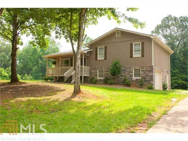 Beautifully remodeled home on a quiet 2 acre lot in Waleska! Full of upgrades! Hardwood floors throughout main floor. Granite countertops, beautiful cabinetry, tile backsplash in kitchen with eat-in area and access to large deck for grilling. Private Master suite with brand new attached Bath. Fully finished basement rec room and large laundry room. Relax on the large deck and entertain your friends. Private backyard with tons of breathing room from the neighbors. Don't miss out on this great deal!!