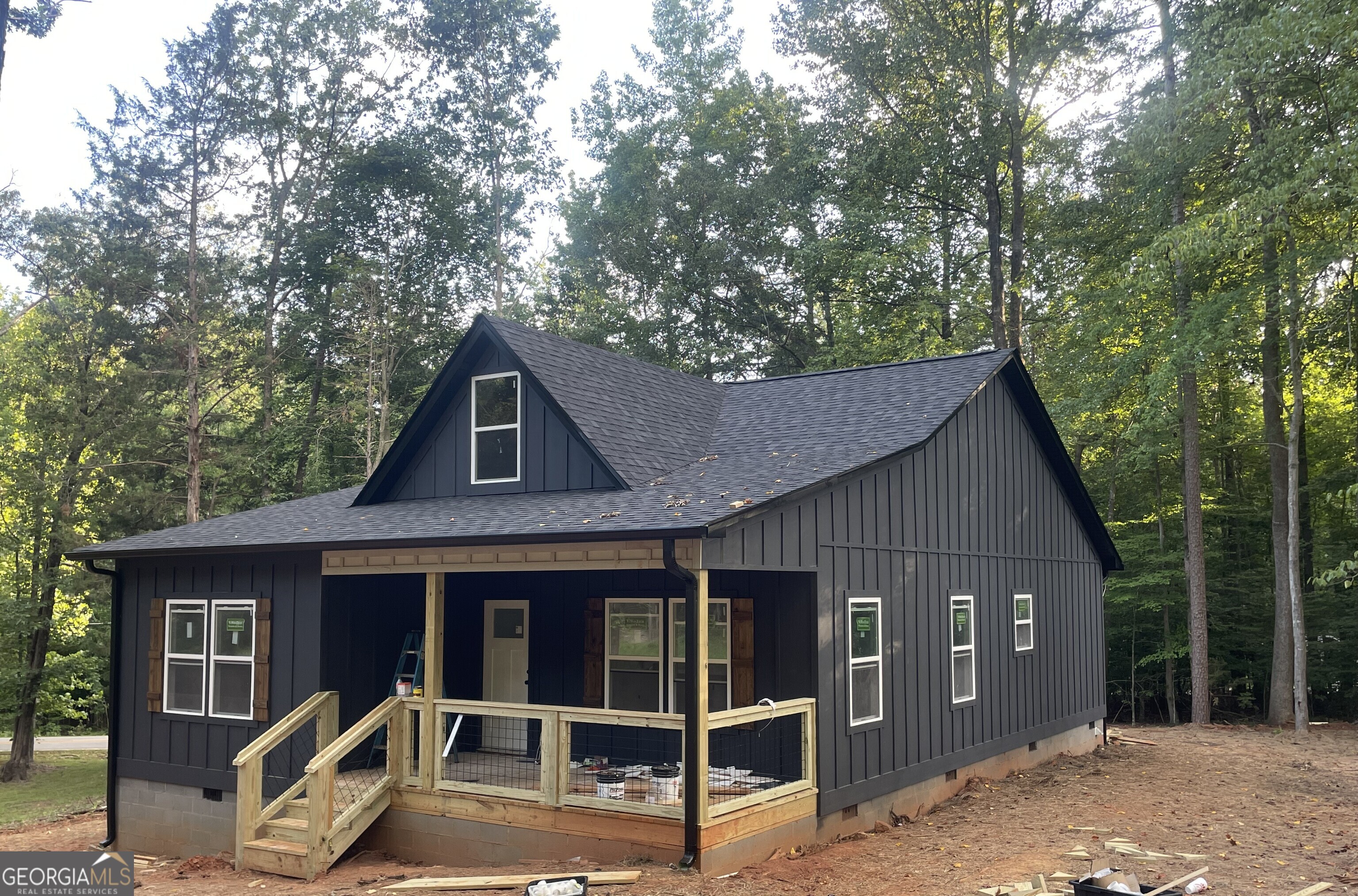 Tucked away in a peaceful, wooded and waterfront neighborhood setting, this brand-new 2 BR, 2 BA home offers the perfect blend of comfort and low maintenance. The bedrooms are quietly tucked away off the main living area, giving you extra privacy in this cozy retreat. You'll love the oversized walk-in closet in the primary suite, and the generous pantry means plenty of space to stay organized. Outside a deep front porch welcomes you with custom-finished beams and shutters, and just off of the kitchen another deck makes a great spot for your outdoor cooking. Property owners in Hartwell Shores are welome to apply for a membership into the Hartwell Shores Country Club (HSCC a private club on Lake Hartwell chartered in 1966). HSCC is one of the best kept secrets on Lake Hartwell offering 16 private covered boat slips,some non covered slips, a private boat launch, picnic area with horseshoe pits, volleyball area, and rustic clubhouse. HSCC is not directly affiliated with or managed by Hartwell Shores Subdivision, but located within the community and a short walk or golf cart ride from Sexton Lane. Please note when using your GPS the street was previously named Lakeview Lane. Utilities available: City of Lavonia Water & Hart EMC Power