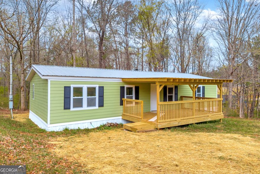 Charming Newly Remodeled Mobile Home!    This beautifully updated mobile home is move-in ready, featuring a spacious open floor plan, ideal for modern living. Perfectly situated with a large yard that's great for both kids and pets to play.    Key Features:    3 Bedrooms & 2 Full Bathrooms - Spacious and comfortable for the whole family.    Completely Renovated - New roof, HVAC system, and plumbing ensure peace of mind.    Bright & Inviting Living Space - Freshly painted with new flooring throughout, creating a warm, welcoming atmosphere.    Modern Kitchen - Brand new countertops, kitchen cabinets, and fixtures, plus a breakfast bar perfect for casual dining.    Cozy Living Area - Featuring a fireplace for added charm and comfort.    Outdoor Living - New front porch and back deck to enjoy the outdoors in style.    This home is truly turnkey, with everything updated for convenience and comfort. Schedule a viewing today!    For Financing call 21st Mortgage Loan Dept. 865-292-2120 ext 1456