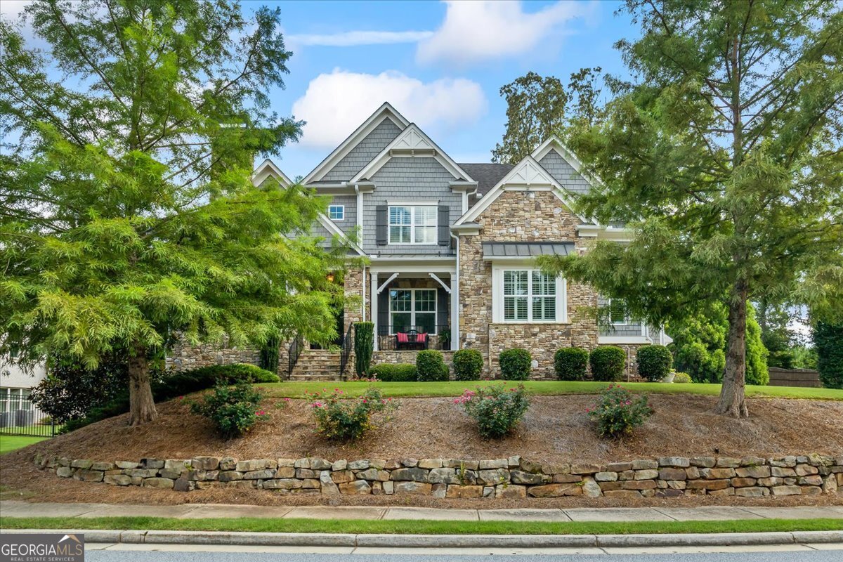 Welcome to this truly exceptional family home! Located on a cul-de-sac in an enclave community of executive style homes. A comfortable blend of elegant sophistication, high quality craftsmanship and distinctive appointments enhance this ideal open floor plan perfect for today's easy lifestyle. The home offers graciously sized rooms on three full finished levels. An impressive 2 story foyer invites you inside to a seamless flow of gleaming hardwood flooring continuing throughout most of the main level. An elegantly appointed dining room affords the perfect atmosphere for more formal mealtime gatherings. Off the Foyer is a private room perfect for a home office, music room, or formal living area. The main level entertaining area features a large family/great room which is open to the breakfast area and gourmet kitchen. All of this area enjoys a view of the magnificent, private pool, spa, firepit, covered outdoor seating area with TV and a grill with accompanying green egg to help prepare a feast for family and friends. Completing the main level is a luxurious Owner's suite providing a lovely view of the pool, and helpful closet built ins to maximize space for your wardrobe. On the top floor you'll find a barn door entrance to a step up bonus room/den/kids play area, etc. plus 4 additional bedrooms and 3 full baths. Two of the bedrooms have ensuite bathrooms, while a third bedroom has private access to a third bathroom. In the terrace level you'll enjoy a huge open area for entertaining! That includes an area for gaming tables such as a pool table/ping pong, a kitchenette, and lounging/TV area. Off of this area is a bedroom, full bath, wine cellar, workout room, and a theater room with a platform for theater chairs, if desired. Please schedule a showing...You won't be disappointed!!!
