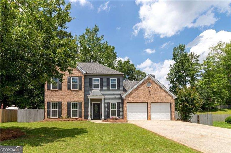 Lovely renovated two-story home nestled on the edge of a cul-de-sac in the well-established Eagle Point subdivision in Marietta is now available. This charmer has an open concept design open to the oversized family room with fireplace and showcases a beautiful white kitchen with quartz counters, stainless appliances, loads of cabinets, breakfast bar, and a breakfast room. The dining room and living room are very spacious and bright and great for entertaining. The Primary suite is a luxurious retreat that features vaulted ceilings in the bedroom, and the en-suite of your dreams with a whirlpool tub big enough for two, an over-sized steam shower, double vanities with quartz counters, and a huge walk-in closet. The secondary bath has quartz counters and is convenient to two other secondary bedrooms which all have wonderful natural light and not to mention the house has updated light and plumbing fixtures throughout. Walk out the family room on the main level to enjoy your huge fenced in yard where you could enjoy grilling on your large deck or having friends over to sit out on your patio and possibly roast marshmallows or maybe just enjoy a moonlit firepit night. Come see this home today, this could be it!