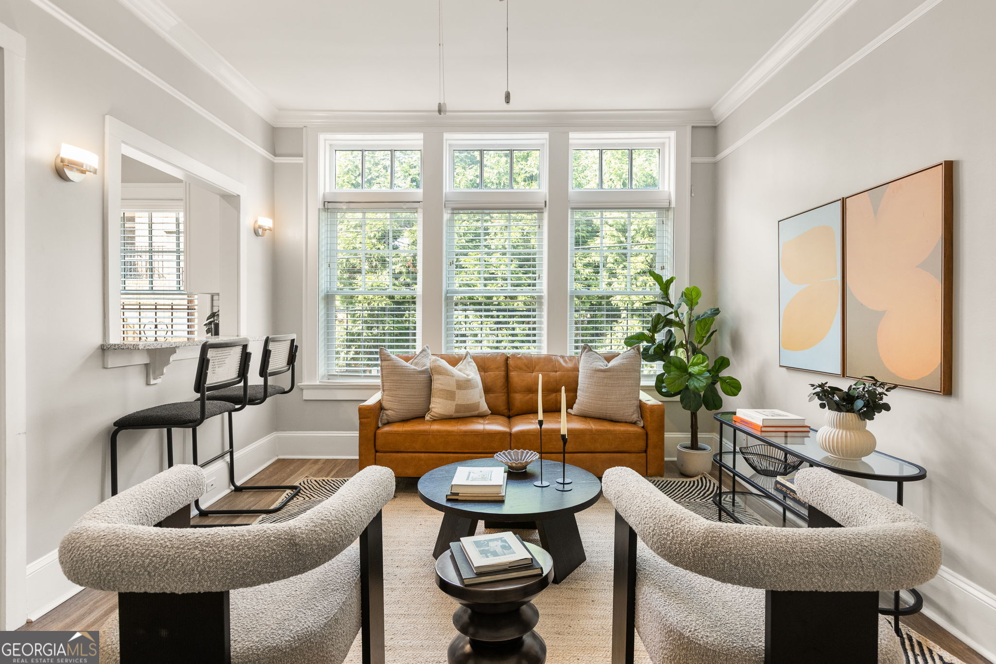 Step into a piece of Midtown history with this gem designed by renowned architect Leila Ross Wilburn. Nestled in the iconic Piedmont & Third Building, this condo radiates timeless character while offering modern updates. The kitchen boasts stone countertops, crisp white cabinetry, and stainless appliances, while the bath features a glass walk-in shower and new tile. Natural light fills the space. With deeded parking in a secured lot, basement storage, and HOA covering water, sewer, and trash, you'll enjoy convenience as much as charm. And with an unbeatable walk score, you're just steps from Piedmont Park, Ponce City Market, restaurants, and retail, truly the best of city living.