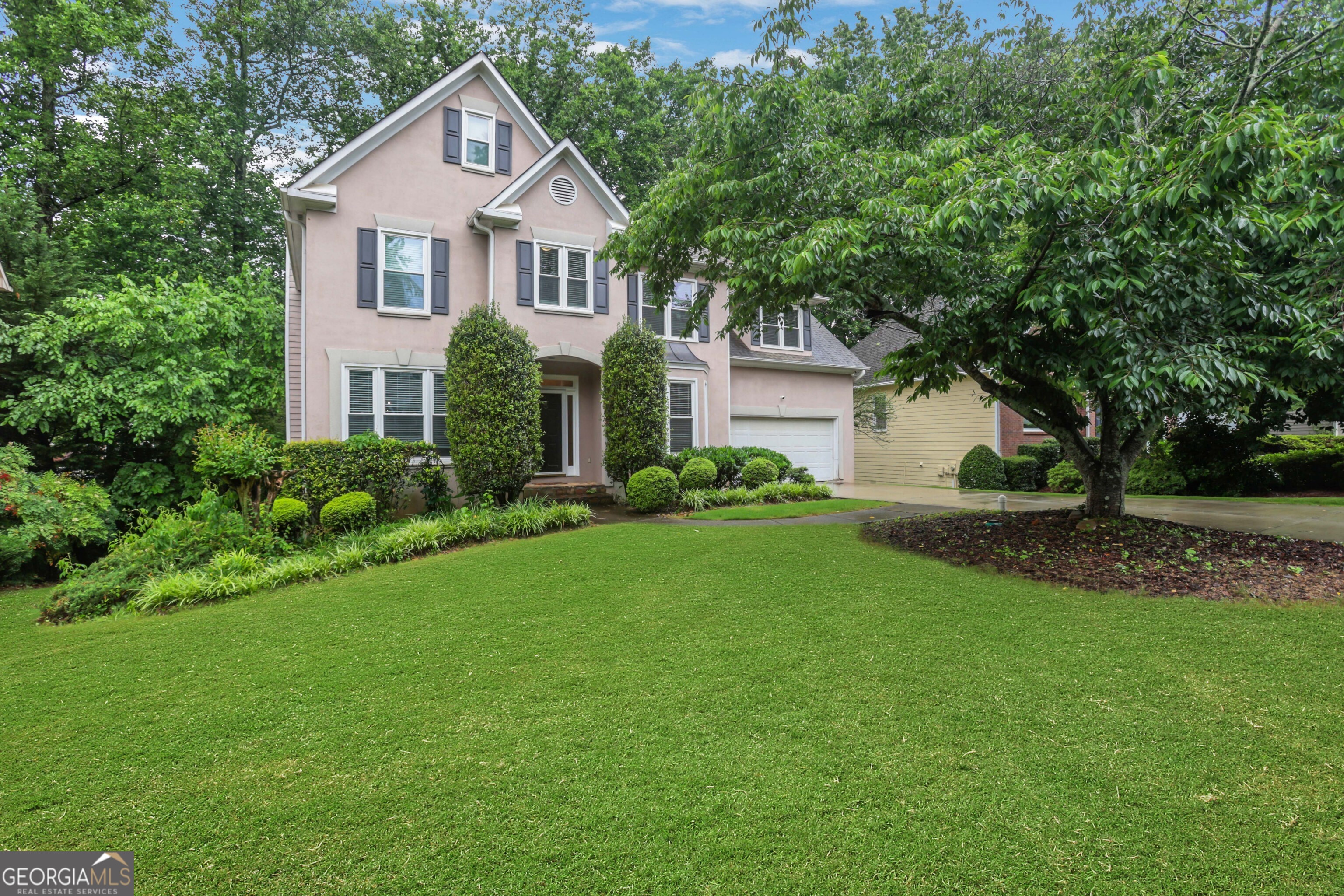 Charming 5-Bedroom Home in Highly-Rated Johns Creek/Alpharetta Community!!! Welcome to your next home, ideally located in one of the nation's top-rated communities. This beautifully updated three-level residence is nestled within a sought-after swim/tennis neighborhood and offers the perfect blend of comfort, style, and functionality. From the moment you step through the front door, you're greeted by a warm foyer with gleaming hardwood floors that flow throughout the main and upper levels. To your right, you'll find a spacious formal dining room perfect for entertaining while to the left, a formal living room leads into a cozy fireside great room. The adjacent renovated kitchen boasts granite countertops, a stainless-steel farmhouse sink, and a bright breakfast area. From here, step into a rustic enclosed porch that opens to the upper level of a two-story deck an ideal spot to enjoy your morning coffee while overlooking the tranquil wooded backyard. Upstairs, the expansive primary suite includes a sitting area, walk-in closet, and a fully updated en-suite bath with a soaking tub and separate shower. Three additional generously sized bedrooms share a full bath. This level also includes a convenient laundry room and a large bonus room perfect as a home office or an extra bedroom. The finished terrace-level basement offers incredible versatility with a recreation room featuring a wet bar, a full bathroom, and two additional rooms ideal for a gym, office, or guest suite. From here, walk out directly to the lower level of the two-story deck and enjoy the peaceful backyard. Located in a top-rated school district and just minutes from Avalon, North Point Mall, Downtown Alpharetta, Roswell, parks, shopping, dining, and GA-400. Multiple grocery options including Kroger and Publix are also nearby.
