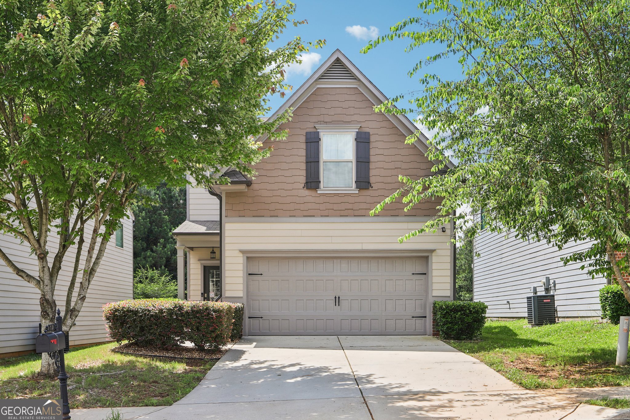 On a peaceful cul-de-sac just outside the hustle and bustle, this traditional home offers an ideal blend of privacy and convenience. Minutes from Lawrenceville and Dacula for a variety of grocery stores, shopping centers, dining options, and major commuter routes, where you'll have everything you need and more. Enjoy easy access to schools, healthcare facilities and a wide variety of recreational amenities, including nearby Freeman Mills Park, and golf courses. Community amenities include a sparkling pool and tennis courts. The home itself welcomes you with cedar shaker accents, and established landscaping that lines the pathway to the covered front porch. Inside, the open-concept main living area offers a spacious family room that flows seamlessly into the kitchen and dining area, perfect for entertaining and everyday living. The kitchen features a large island with breakfast bar for added dining and serving space, granite countertops, stainless steel appliances, walk-in pantry, and a mix of recessed and pendant lighting to create the perfect ambience. A convenient laundry room and half bath complete the main level. Upstairs, the primary suite boasts a double vanity, walk-in shower, soaking tub, and a spacious closet. Three additional bedrooms and a full bath provide ample space for family or guests. New Ring Alarm System Smart with thermostats, doorbell, and floodlight about the garage. All included! Step outside to your private backyard with wooded views and the protected Alcovy River as your backdrop, ensuring permanent privacy with no rear neighbors. This home combines serene living with everyday convenience and is ready to welcome you home!