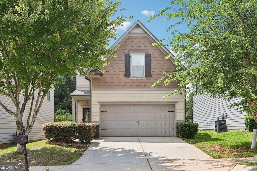 On a peaceful cul-de-sac just outside the hustle and bustle, this traditional home offers an ideal blend of privacy and convenience. Minutes from Lawrenceville and Dacula for a variety of grocery stores, shopping centers, dining options, and major commuter routes, where you'll have everything you need and more. Enjoy easy access to schools, healthcare facilities and a wide variety of recreational amenities, including nearby Freeman Mills Park, and golf courses. Community amenities include a sparkling pool and tennis courts. The home itself welcomes you with cedar shaker accents, and established landscaping that lines the pathway to the covered front porch. Inside, the open-concept main living area offers a spacious family room that flows seamlessly into the kitchen and dining area, perfect for entertaining and everyday living. The kitchen features a large island with breakfast bar for added dining and serving space, granite countertops, stainless steel appliances, walk-in pantry, and a mix of recessed and pendant lighting to create the perfect ambience. A convenient laundry room and half bath complete the main level. Upstairs, the primary suite boasts a double vanity, walk-in shower, soaking tub, and a spacious closet. Three additional bedrooms and a full bath provide ample space for family or guests. New Ring Alarm System Smart with thermostats, doorbell, and floodlight about the garage. All included! Step outside to your private backyard with wooded views and the protected Alcovy River as your backdrop, ensuring permanent privacy with no rear neighbors. This home combines serene living with everyday convenience and is ready to welcome you home!