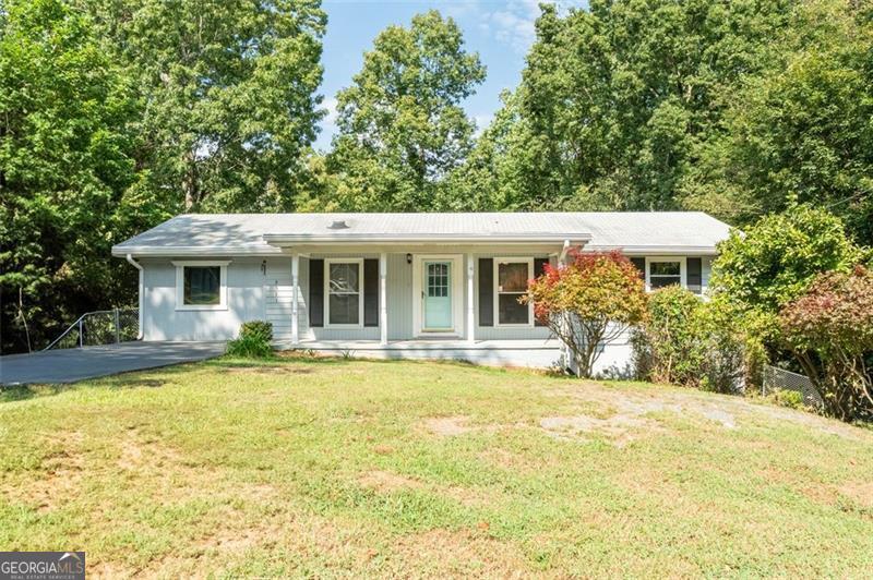 LOCATION, LOCATION, LOCATION! This spacious 5-bedroom, 2.5-bath home is perfectly located in the heart of downtown Kennesaw, offering both comfort and convenience. The main level features a bright open layout with generous spaces, perfect for everyday living and entertaining. With plenty of natural light, creating a warm and inviting atmosphere. One of the highlights of this property is the fully finished basement with its own kitchen and bedroom-an ideal in-law suite, guest retreat, or rental opportunity. Outside, enjoy a fenced in backyard with room to relax, garden, or host gatherings. With its unbeatable location just minutes from shopping, dining, and community events in downtown Kennesaw, this home offers the best of both convenience and charm. Don't miss your chance to make this your next home!
