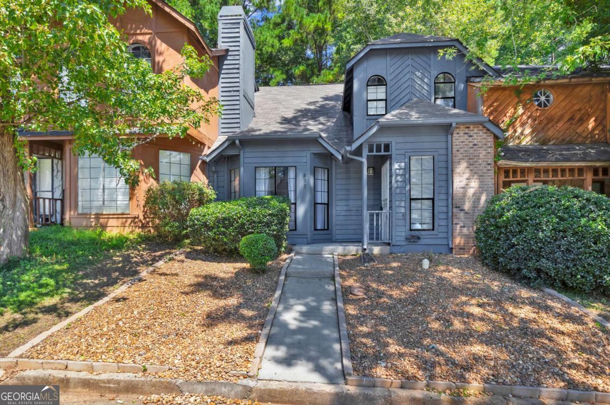 Welcome home to 832 Heritage Oaks, a beautifully updated 2-bedroom, 2.5-bath townhome tucked inside the sought-after Heritage Oaks community. From the moment you step inside, the soaring vaulted ceilings and striking stone fireplace make a bold first impression, while the open layout invites you to relax and stay awhile. Natural light pours through the large windows, bouncing off fresh finishes and modern details that make this home truly move-in ready. The kitchen has been updated with granite counters, stainless steel appliances, and sleek fixtures, creating a perfect space for both everyday meals and entertaining. Just off the kitchen, the dining room flows easily into the living area, making the entire main floor warm and connected. Each bathroom has been stylishly renovated with designer tile and updated vanities, giving the home a fresh, contemporary feel. Upstairs, you'll find spacious bedrooms that offer plenty of comfort and natural light. Enjoy mornings in the sunroom with a cup of coffee or step out back to the private fenced yard with a patio that's just waiting for summer barbecues and quiet evenings under the string lights. Fresh exterior paint adds curb appeal, while the community itself provides access to a swimming pool, tennis courts, and a park making it easy to live, play, and unwind without leaving the neighborhood. Conveniently located just minutes from Stone Mountain Park and Highway 78, this home blends lifestyle, location, and comfort all in one. Whether you're looking for your first home, downsizing, or investing, 832 Heritage Oaks Way is a place you'll be proud to call your own.