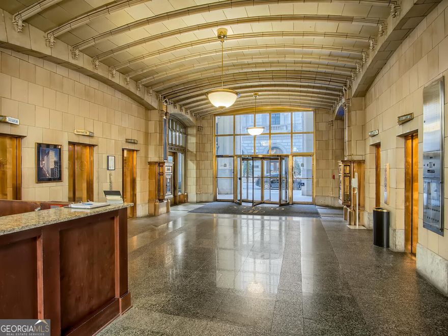 Don't miss this rare chance to enjoy luxury living in the historic Healey Building, where timeless architecture meets unbeatable city convenience. From the moment you step inside, the charm of this landmark building welcomes you home.  The living room is lined with 8-foot windows, offering stunning, long-range views and filling the space with natural light. Hardwood floors run throughout, and the stylish kitchen features granite countertops along with an in-unit washer and dryer for everyday ease. Relax and recharge in the spa-like bathroom, designed to be your personal retreat.  Your lease includes cable, internet, trash service, 24/7 concierge, bicycle storage, a fitness center, and a guest suite. Step outside and walk to Centennial Olympic Park, Georgia State University, State Farm Arena, Mercedes-Benz Stadium, theaters, restaurants, Woodruff Park, and more. Prefer transit? MARTA is just moments away for quick access around the city.