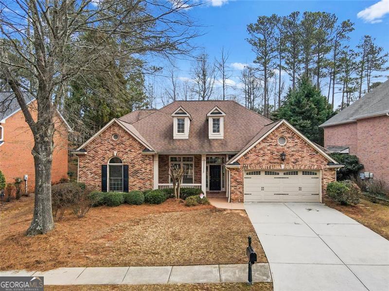 This stunning 3-sided brick ranch offers spacious living and luxurious upgrades throughout. Featuring 3 bedrooms and 2 full baths, this home boasts a primary bedroom on the main level with its own fireplace and heated floors in the primary bath for added comfort. The open floor plan includes a breakfast area, a cozy family room, a formal dining room, and a living room, perfect for entertaining. The home is filled with character, from the wood beam accents to the stone fireplace and indoor waterfall in the main living area. Upstairs, you'll find a loft/bonus room complete with a wet bar, ideal for additional entertainment space. Downstairs, enjoy the flexibility of a home office/flex room and a convenient laundry room with a sink. Step outside to your private oasis featuring a front porch, patio, pool, and hot tub, perfect for relaxation or entertaining. This home is located in the desirable Windward community, offering access to a lake, golf, tennis, and scenic walking paths. Conveniently close to GA-400, Windward Parkway shops, Avalon, and more, you'll enjoy both luxury and convenience in one place.
