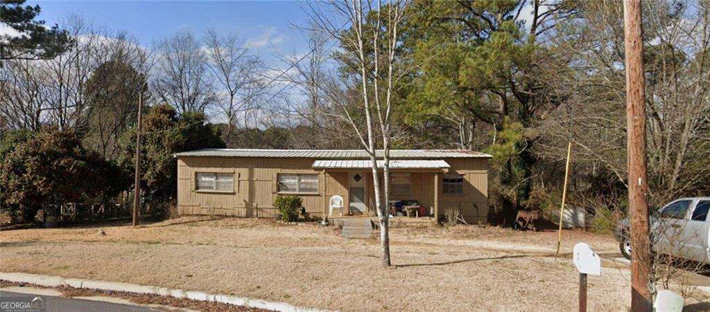 Welcome to this unique Modular/Mobile Home. Providing you with 3 beds, 2 baths, & 1,200sqft whether it's to finish renovating it yourself or to use the land for your next big project the neighborhood is there to provide its ideal community. Located in the prominent Gwinnett County School district the local high school is walking distance away so it is a perfect location to build a family! Don't miss out on this last opportunity to be able to finish out your dream home in one of the best sectors of Gwinnett County.