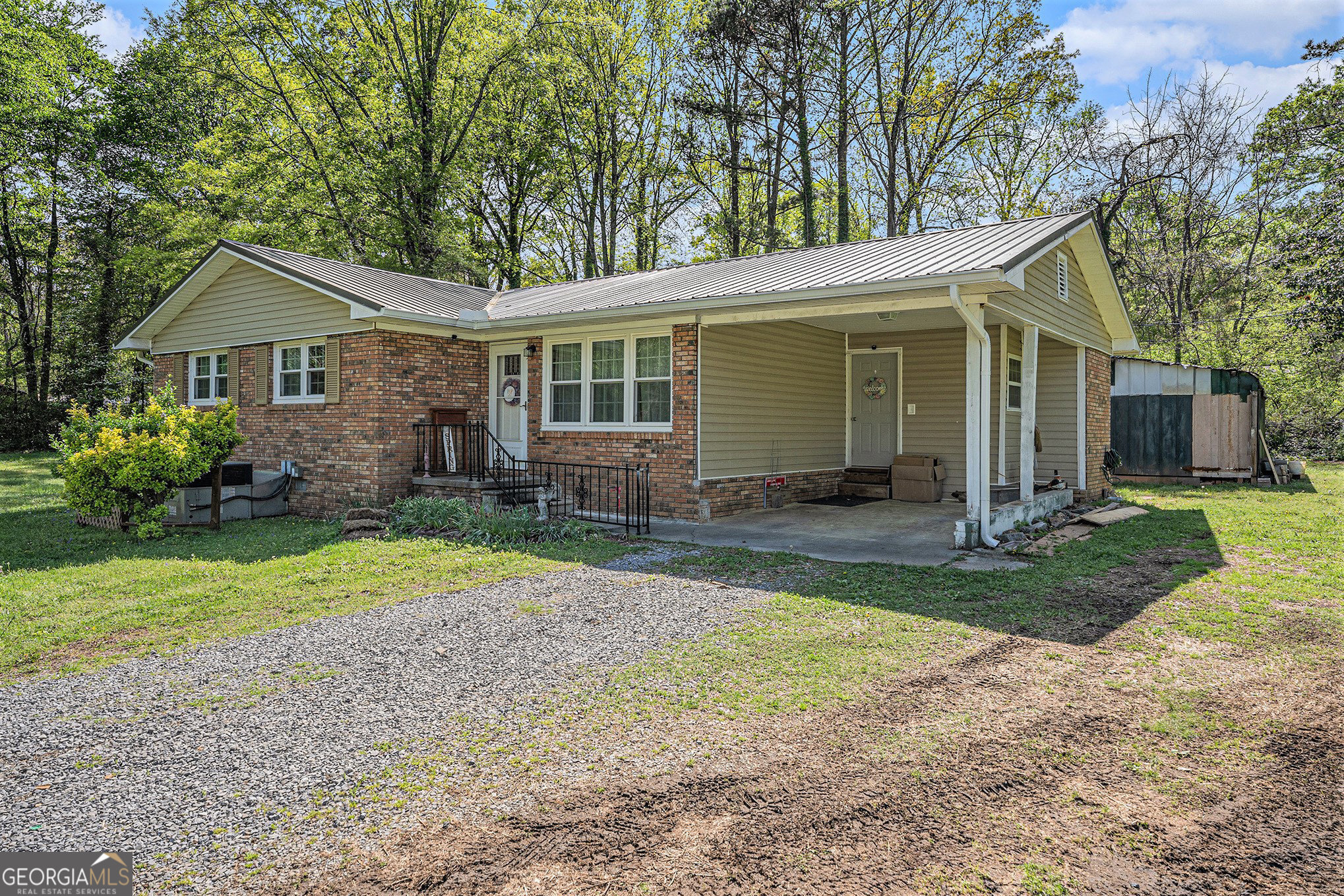 Charming Brick Ranch on a Spacious Corner Lot! Welcome home to this beautifully updated 3-bedroom, 1.5-bath brick ranch nestled on a large, fenced-in corner lot - perfect for pets, kids, and privacy lovers alike! Step inside and fall in love with the warm and inviting mix of natural pine and sheetrock walls, giving the home a unique rustic-modern charm. The updated kitchen features stunning quartz countertops, sleek cabinetry, and modern fixtures - a true chef's delight! The main bath includes a luxurious walk-in tile shower that adds a touch of spa-like comfort to your daily routine. Outdoors, the property shines with a fantastic entertainment area, ideal for hosting friends and family - or just relaxing under the stars. This home offers comfort, character, and convenience all in one place. Don't miss your chance to tour this Northwest Georgia gem!