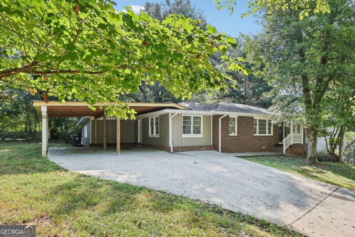 Welcome Home to this newly renovated, 4 bedroom 2.5 bath, brick ranch home in the heart of downtown Acworth! Home is Move in Ready with LVP plank flooring throughout, a family room, spacious kitchen with abundant oak cabinetry, updated countertops, a separate dining room and a versatile split bedroom or roommate layout with 2 bedrooms and a full bath on each side of the house with separate entry. There is also a deck outside overlooking the level, backyard that's perfect for relaxation. Situated close to shopping, schools, dining and quick access to I-75, this one will not last...don't miss this opportunity...Call to schedule your tour today.!!