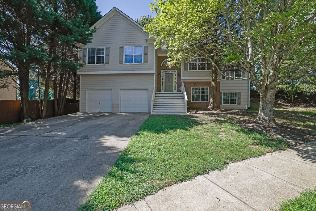 Come see this 4 bedroom, 2.5 bathroom home on a beautiful, spacious lot in a quiet neighborhood. The kitchen is lovely, there's a formal living room, dining room, and sitting room with fireplace. Three bedrooms are upstairs. Generously oversized master suit with a walk in closets and a sitting room!! This is being sold as-is but it's A MUST see!