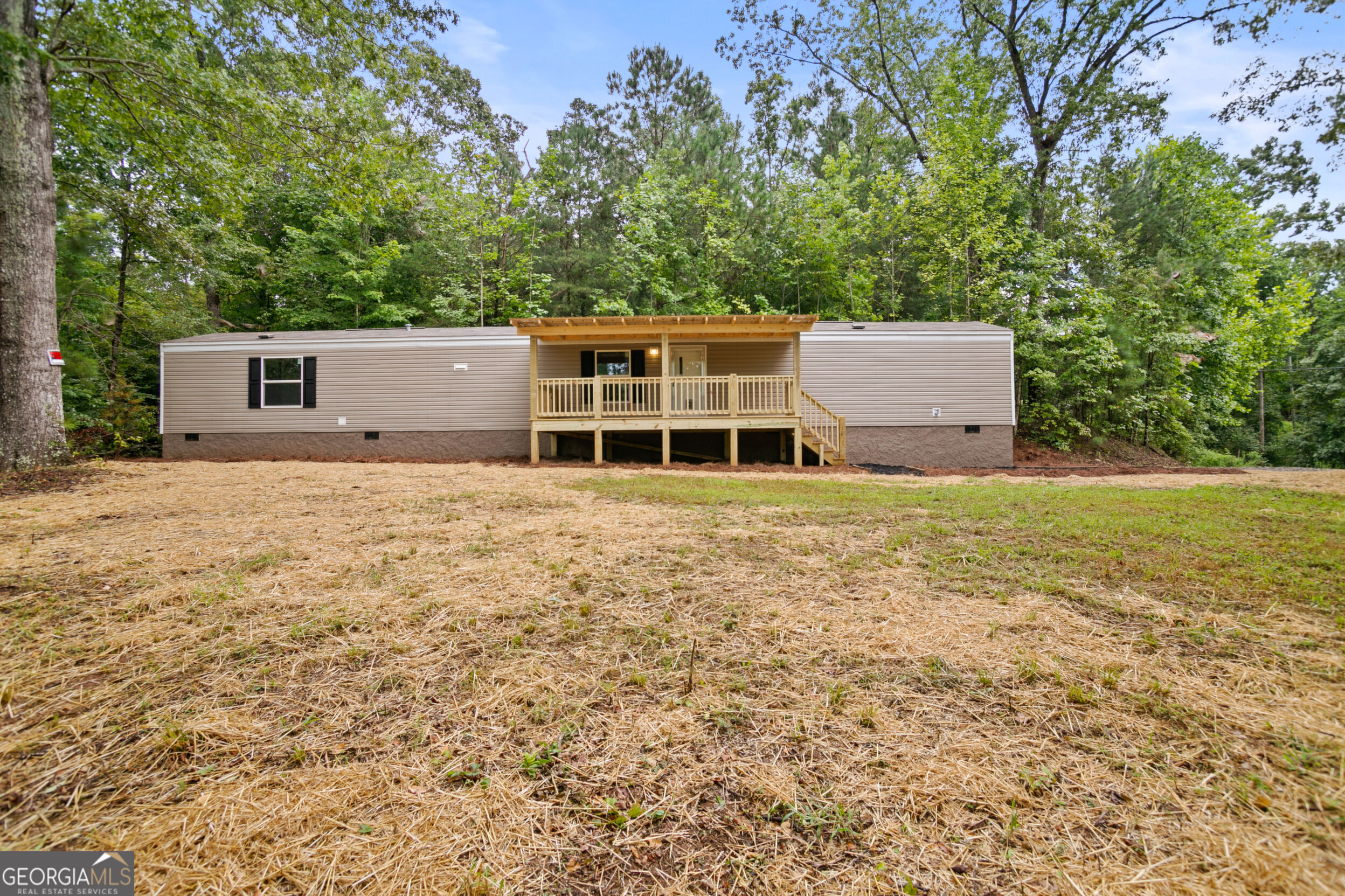 NEW 3BR/2BA HOME ON PERMANENT FOUNDATION~ SITTING ON WOODED 1.57 AC UNRESTRICTED LOT~ SEASONAL MOUNTAIN VIEWS AND SMALL STREAM ON PROPERTY. Dont miss the opportunity to own a brand new home for a great price~ Open Concept Living/Dining/Kitchen, Large Pantry/Laundry Combo, Split Floor Plan with Master Suite, and two guest bedrooms/guest bathroom. Enjoy the Sunset Views and Abundant Wildlife from the 8x20 Covered Front Porch, or the cozy 5x5 Back Porch. Home situated on a 1.56 Acre Wooded lot with level front yard perfect for kids, pets, or garden! Great Location, only 15 minutes to Ellijay and Jasper. (Home size is considered a "single wide" but regular home financing available~ see special remarks)