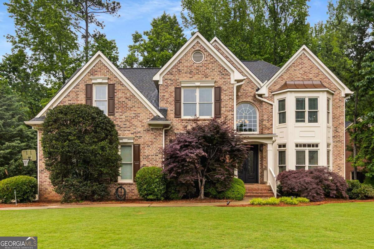 Beautifully updated and move-in ready home on large picturesque corner lot in sought after Northampton! Rarely available floor plan featuring brick and upgraded hardiplank siding, guest bedroom/office on main level, hard to find side entry 2 car garage! Updated kitchen featuring stainless steel appliances, granite countertops, marble tile backsplash, updated lighting and large island opens to large vaulted family room with fireplace, built-in bookcases & wall of windows! Large rear deck off kitchen overlooking the private flat backyard. This home is truly special - when being built, the builder made this floorplan two feet wider than the standard - and it really shows! Built for both living and for entertaining. The Living and Dining Rooms really do feel live larger than most of the homes and offer a great flow for entertaining. Site finished oak hardwoods throughout the main level. Upstairs features a large primary bedroom with an additional flex room - perfect for a home office or huge walk-in closet/exercise room/sitting room/nursery etc! Secondary bedrooms are generous and all have access to bathrooms. Laundry is conveniently located upstairs for easy living! The large finished daylight terrace level features upgraded LVP flooring and offers additional living space, bedroom space, playroom, full bath, workshop and even more storage! There is an additional outdoor entertainment area located off of the basement that is covered/rain protected! This incredible, happy home is ready for its next chapter - welcome to your new home!