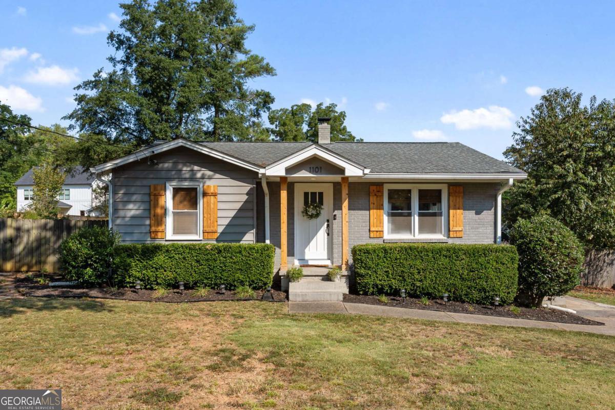 Welcome to 1101 McLinden Avenue SE, a beautifully updated ranch just brimming with Smyrna character and modern comforts. Step inside this inviting home to discover original hardwood floors, crisp crown molding, and beadboard ceilings - touches that whisper "classic Southern home" with contemporary flair. The bright, sunny family room is ideal for cozy gatherings or quiet mornings. The kitchen features white cabinets, a pantry, solid-surface counters, and stainless-steel appliances, perfect for both first-time chefs and casual meals. Retreat to one of three spacious bedrooms finished with accent walls and decorative trim for personality without compromise. Outside, the property impresses with a large, level, fenced backyard complete with a shed and three separate entertaining spaces, prime for relaxing, grilling, gardening or hosting friends. Peace of mind comes built in: recent upgrades include tree removal, yard grading, landscaping, new HVAC + ducting, new exterior doors, encapsulated crawlspace with dehumidifier, and updated electrical outlets & fixtures. Situated in a vibrant Smyrna neighborhood, this home puts you within a 1/2 mile walk to Smyrna Market Village, and close to West Village, the Silver Comet Trail, Cumberland Mall, Truist Park & The Battery, plus Taylor-Brawner Park. Commuters will appreciate easy access to major interstates. And with future redevelopment in downtown Smyrna, hot new shops, restaurants, and gathering spots are coming your way in the next couple of years, with Still Fire Brewing making its debut toward the end of the year.