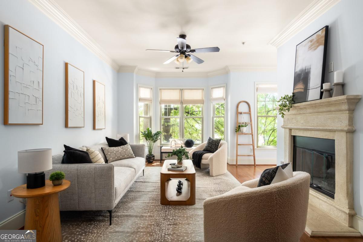 Live beautifully in one of Atlanta's most coveted neighborhoods-Virginia Highland-just seconds from the BeltLine, Freedom Parkway Trail, Ponce City Market, Inman Park, and everything that makes intown living exceptional. This elevated residence at The Carlton is the perfect blend of modern comfort and timeless style. With an open-concept layout, sleek stainless steel appliances, a cozy gas fireplace, and newly refinished dark bamboo floors (2021), every inch of this condo feels intentional and inviting. The spacious primary suite features a fully remodeled walk-in shower and a custom closet system (2023) designed for effortless organization. Additional upgrades include: - New window treatments and plantation shutters throughout (2021) - Built-in Queen Murphy bed (2021) - New refrigerator (2022) - HVAC surge protection system (2022) Enjoy the convenience of a bonus storage unit, covered and assigned gated parking, and community amenities like a resort-style pool, electric car charging stations, bike racks, manicured grounds, and TWO friendly dog runs. The Carlton offers a rare opportunity to enjoy refined, lock-and-leave living in a location that truly has it all.