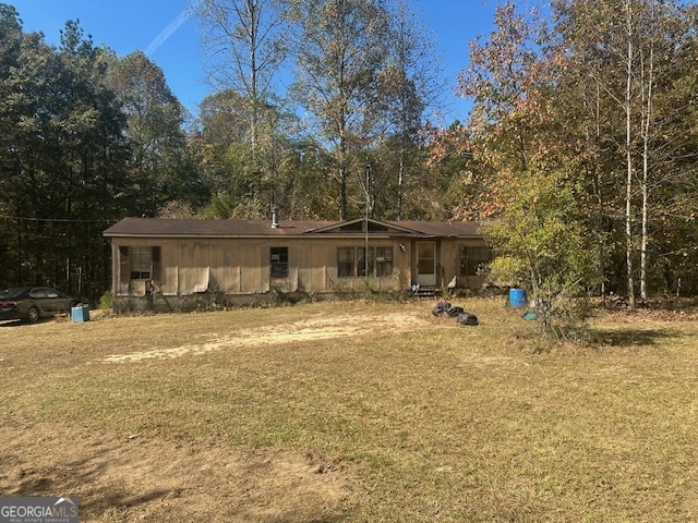 Welcome to this unique opportunity! Nestled in a serene rural setting, this cleared-out 6-acre lot is a blank canvas waiting for your vision. Imagine the possibilities: whether you're looking to build your dream home, invest in a subdivision, or create a peaceful retreat away from the hustle and bustle of city life. This property features a spacious detached 3-car maintenance garage, perfect for storing vehicles, equipment, or turning into a workshop. The double-wide trailer on the lot offers potential but is in need of full renovation or could be removed to make way for new construction. With ample space and the potential for subdivision, this lot presents an excellent investment opportunity. Enjoy the tranquility of rural living while still being close to local amenities. Don't miss your chance to create something special on this expansive property! Contact us today to explore the possibilities!