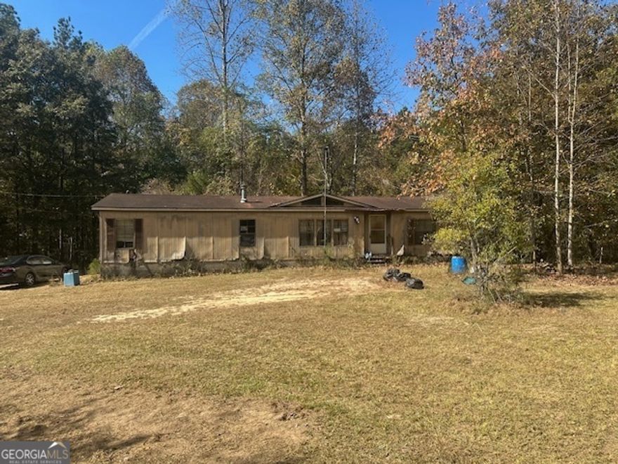 Welcome to this unique opportunity! Nestled in a serene rural setting, this cleared-out 6-acre lot is a blank canvas waiting for your vision. Imagine the possibilities: whether you're looking to build your dream home, invest in a subdivision, or create a peaceful retreat away from the hustle and bustle of city life.    This property features a spacious detached 3-car maintenance garage, perfect for storing vehicles, equipment, or turning into a workshop. The double-wide trailer on the lot offers potential but is in need of full renovation or could be removed to make way for new construction.    With ample space and the potential for subdivision, this lot presents an excellent investment opportunity. Enjoy the tranquility of rural living while still being close to local amenities. Don't miss your chance to create something special on this expansive property! Contact us today to explore the possibilities!