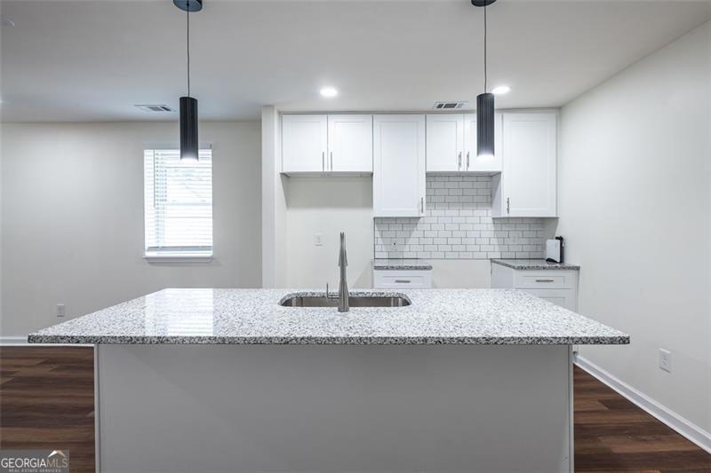 Welcome to your next home in one of Atlantas most connected and vibrant neighborhoods. Located just minutes from shopping, local parks, and public transportation, this home offers the perfect blend of accessibility and comfort, whether youre commuting to work, enjoying the citys cultural offerings, or exploring nearby green spaces. This fully renovated 2-bedroom, 2-bathroom duplex is designed for stylish, low-maintenance living. Enter inside and youll immediately notice the open-concept floor plan, highlighted by gleaming hardwood floors, spacious closets, and ceiling fans throughout. The heart of the home is the kitchen, which is both functional and beautiful, featuring a large island with granite countertops, a sleek tile backsplash, and stainless steel appliances that make meal prep and hosting a joy. Appliances will be installed by move-in. Each of the two bathrooms offers a thoughtful layout: one features a walk-in shower for quick, refreshing mornings, and the other boasts a shower/tub combo for when you need to relax and unwind. Outside, a fenced-in backyard provides a private escape perfect for entertaining or simply enjoying the outdoors. Dont miss this opportunity to live in a beautifully updated home in a prime Atlanta location. This property has an income requirement of under 120% AMI. Please see the last photo. All Sovereign Realty & Management residents are enrolled in the Resident Benefits Package (RBP) for $35.00/month which includes liability insurance, credit building to help boost the residents credit score with timely rent payments, our best-in-class resident rewards program, on-demand pest control, and much more! More details upon application.
