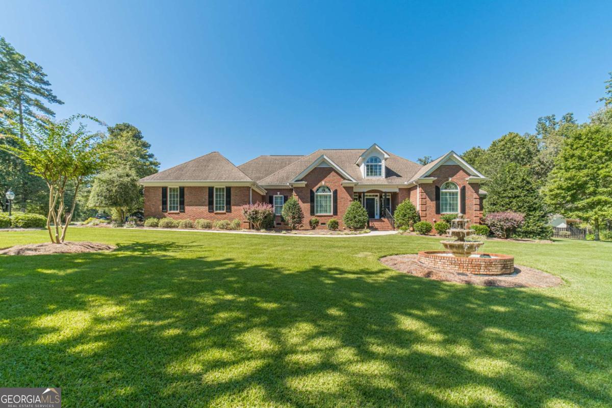 Custom-Built 5-Bedroom Ranch Estate with Pool, Guest Apartment & No HOA This one-of-a-kind custom-built ranch on a large, level corner lot offers unmatched space, craftsmanship, and amenities-all with no HOA. Designed and built by the builder/owner, this meticulously maintained one-owner home is loaded with luxury details inside and out. The main residence features 5 bedrooms and 4.5 bathrooms, hardwood floors throughout, and multiple living spaces including a great room with authentic pub-style bar, wood beam ceilings, and sink with built-in refrigerators, a separate family room with fireplace, a library, bonus room, exercise room, and media room. The oversized master suite includes a tray ceiling, fireplace, custom walk-in closet, and a spa-like tile bathroom with double vanities, soaking tub, and separate shower. The chef's kitchen boasts custom cabinetry, a large island, stainless appliances, and a keeping room. Outdoor living is equally impressive with an in-ground saltwater pool and pool house, outdoor kitchen, outdoor fireplace, and professionally landscaped yard with irrigation and a three-tiered fountain. A detached garage includes a workshop and a full apartment with bedroom, living room, kitchen, and bath-ideal for guests, in-laws, or rental income. Additional highlights include a carriage house, 5-car garage, and parking for up to 20 vehicles with side access. This estate blends elegance, comfort, and functionality, offering the perfect retreat for entertaining, family living, or multi-generational needs. Homes like this are rare-don't miss your chance!