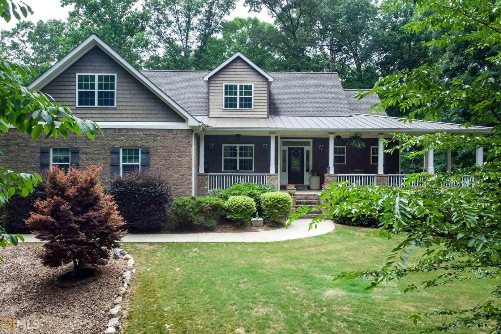 Easy Access to Newnan & Peachtree City - Beautiful 4 Sided Custom Brick Home On 10 Acres! 5 BR 4 1/2 BA W/Master Suite On Main + 2 Additional Bedrooms. Bonus RM W/1/2 BA (5th BR or Office) Great Home & Location To Entertain Friends & Family. Main Level Includes Formal DR, FR W/Wood Burning FP & Designer Kitchen W/SS Appliances, Solid Counter Tops Open To Keeping Room W/Masonry FP. Everything At Your Fingertips On Main Level W/Full Finished Basement W/Private BR & BA. Enjoy Your Time In The Sunroom W/Walk Out To LG Patio & Wood Burning Exterior Fire Pit. Lot's Of Storage With Additional 2 Car Garage.