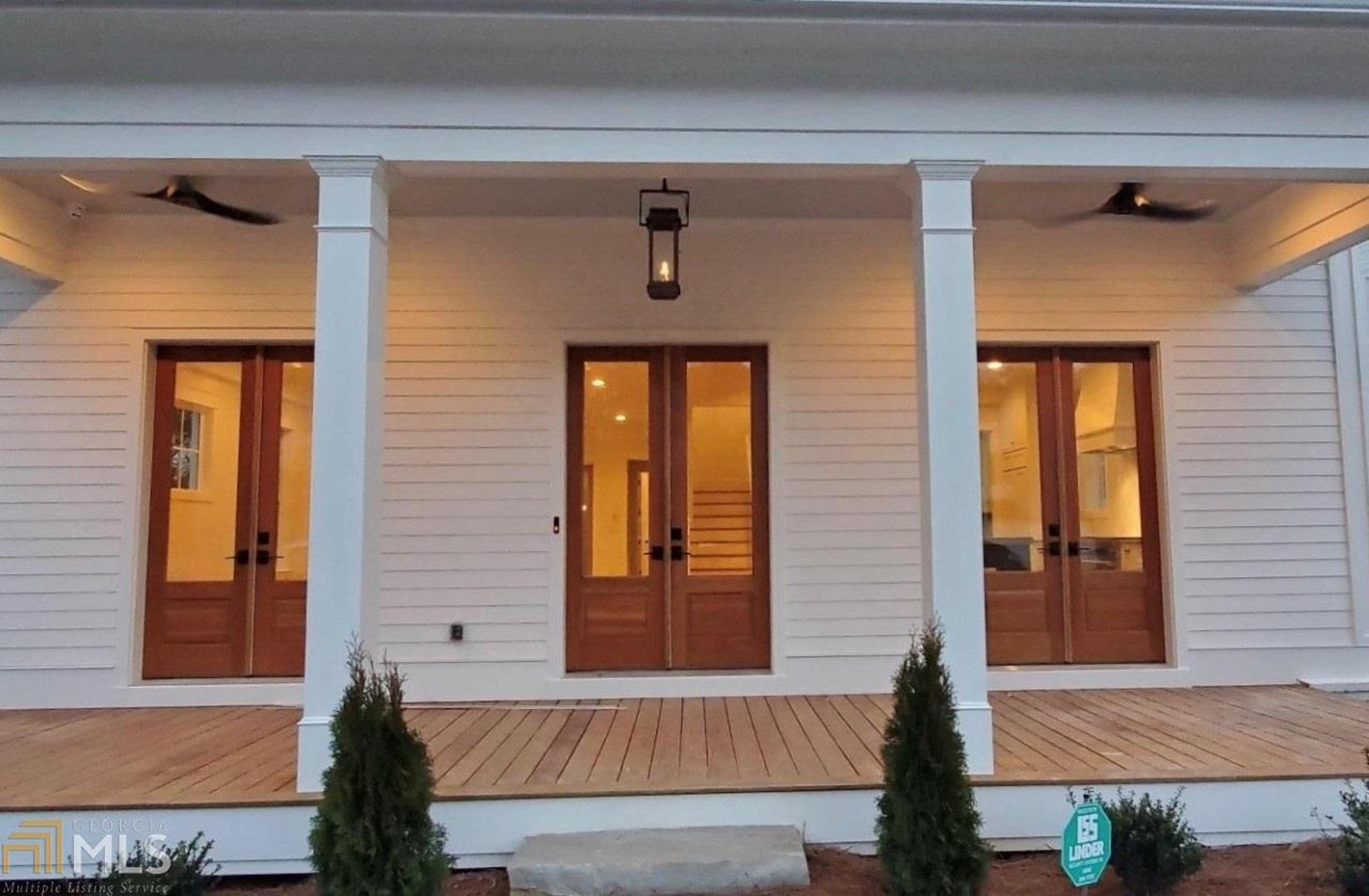 Gorgeous New Custom Master on Main Modern Farmhouse Walkable to Downtown Alpharetta Dining Shops and Parks!  This home was custom crafted with unique architectural features, designer touches at every turn and Lehigh Homes immaculate attention to detail.  With a welcoming front porch, covered deck and fantastic yard it is an outdoor lover's dream and so convenient to everything!  This stunning custom home was lovingly created with inspiring designer touches throughout including rich site-finished floors, custom painted cabinetry, quartz tops, a grand chef styled kitchen, deco tile, extensive millwork, impressive lighting and so much more!  The layout is a dream with an expansive owner's suite on the main with spa-like bathroom, bright open kitchen and great room and spacious dining room.  With 2ndary bedroom suites, a bonus room and media room in this custom home, there is room for everyone and plenty of entertainment!
